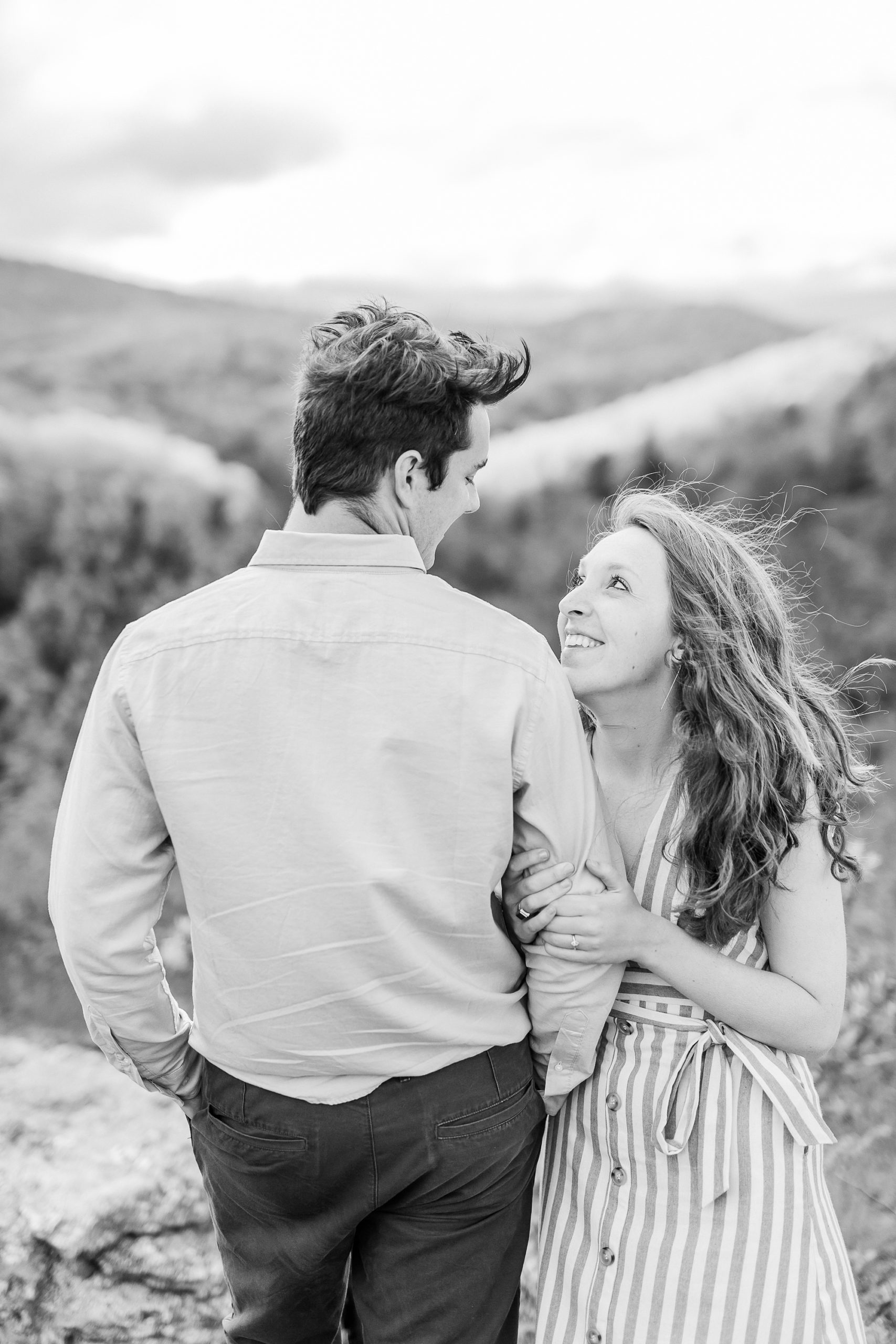 bride looks up at groom during Boone NC spring engagement photos
