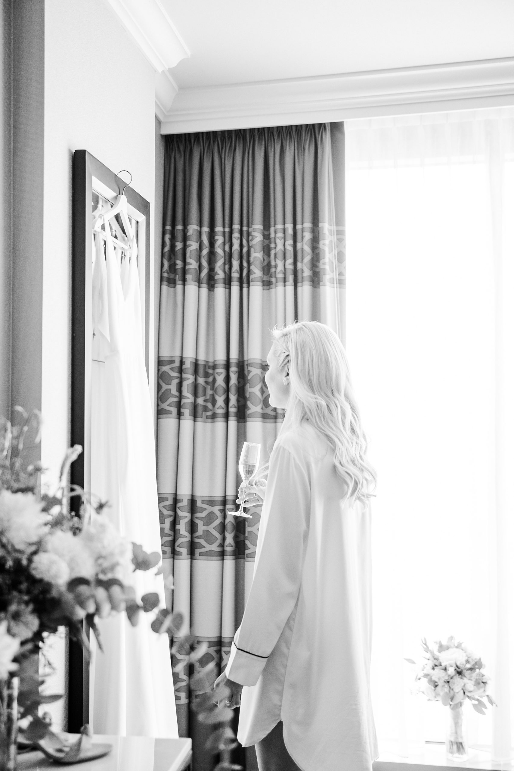 bride looks at wedding dress at Kimpton Hotel