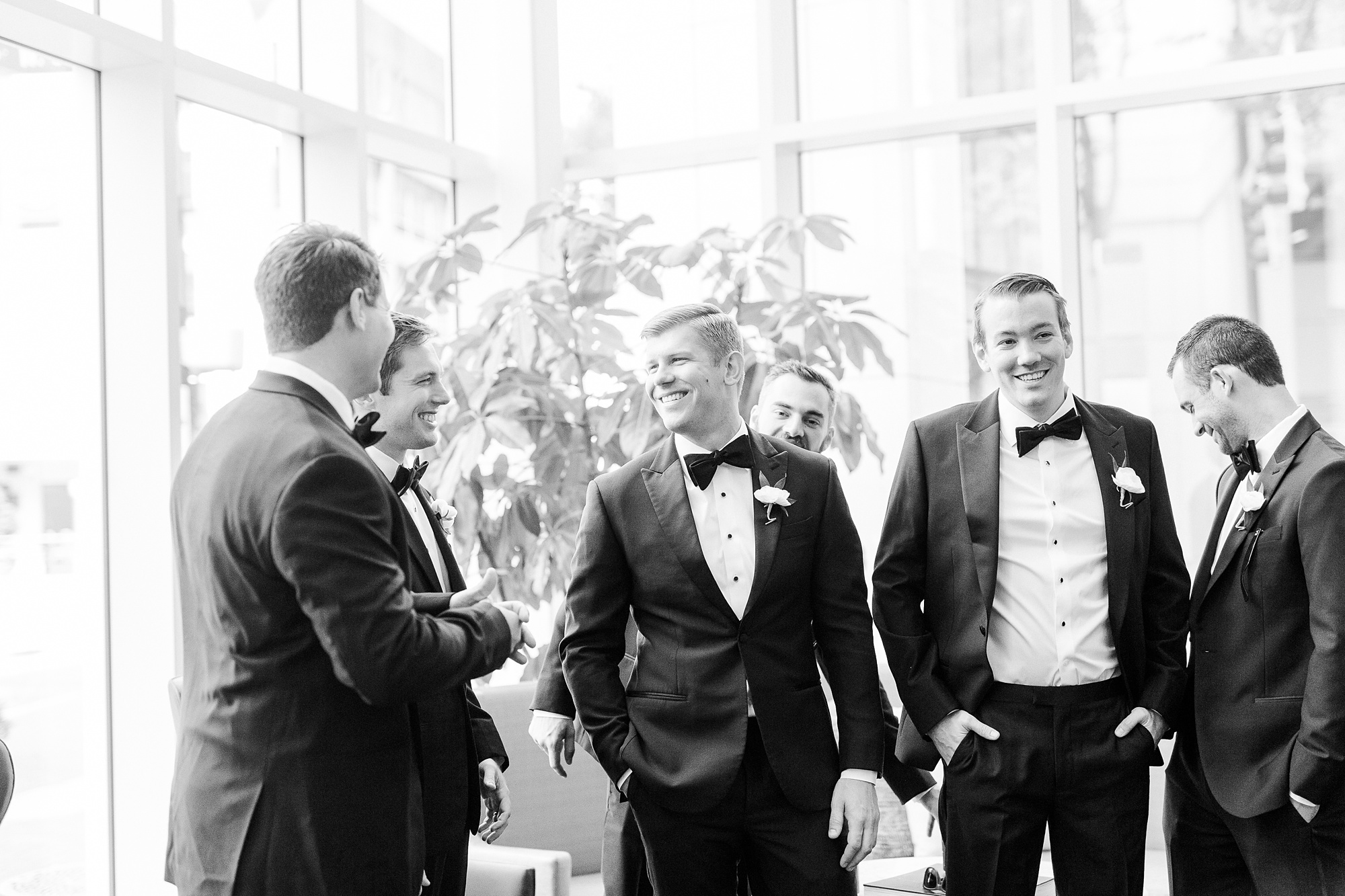 groom and groomsmen laugh before Byron's South End wedding