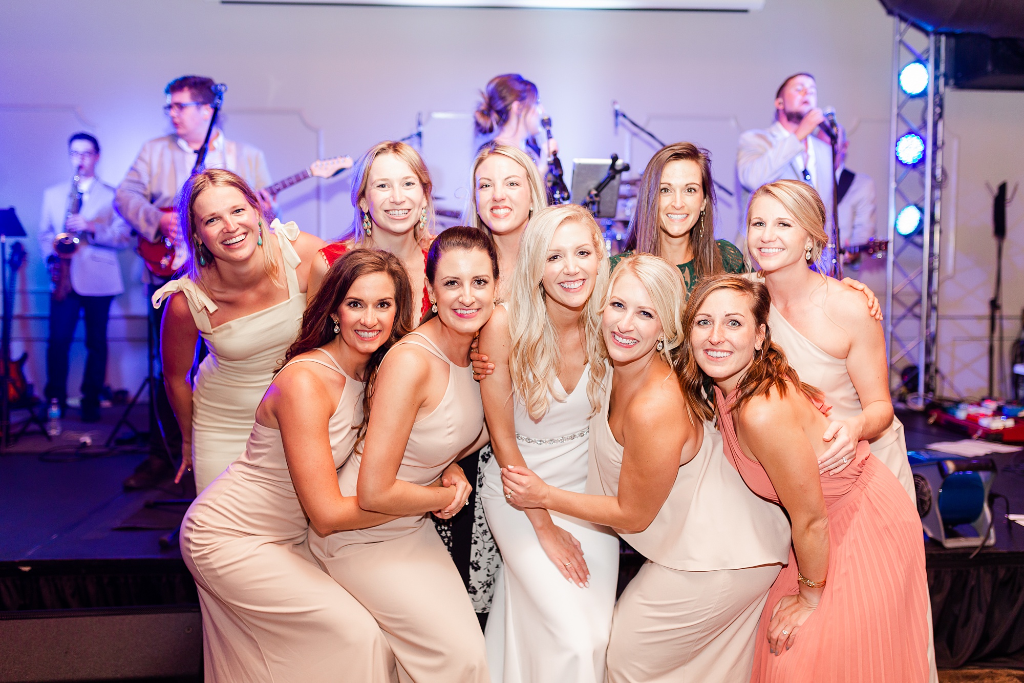 bride poses with bridesmaids