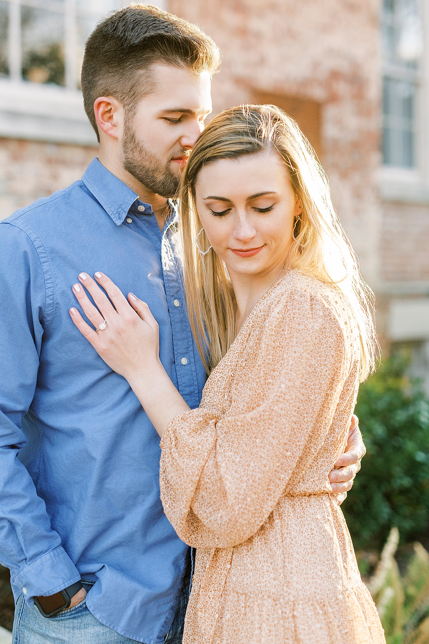 UNC Chapel Hill alumni pose together during engagement photos on campus