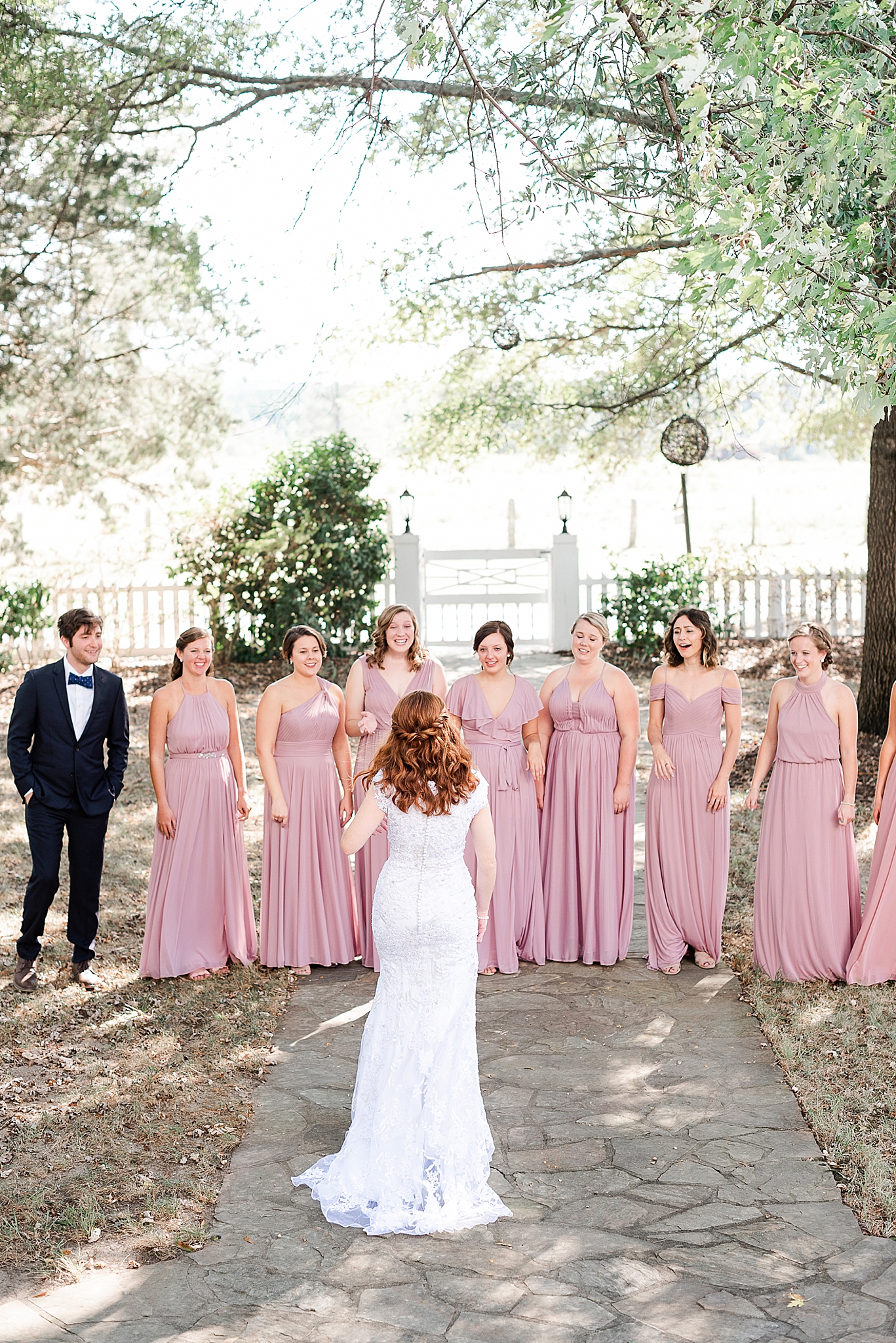 bride has first look with bridesmaids