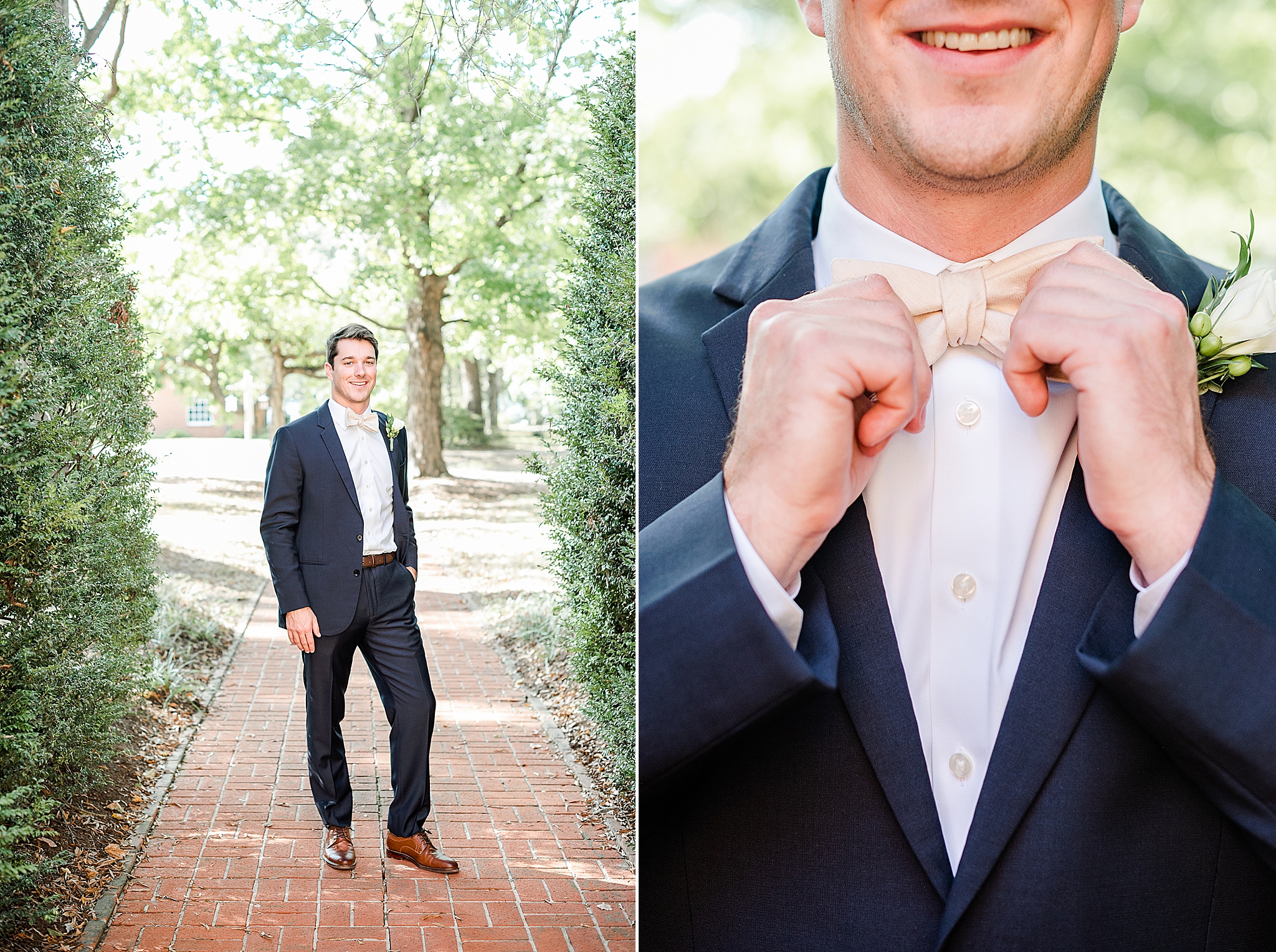 groom in navy suit with blush tie poses on brick walkway