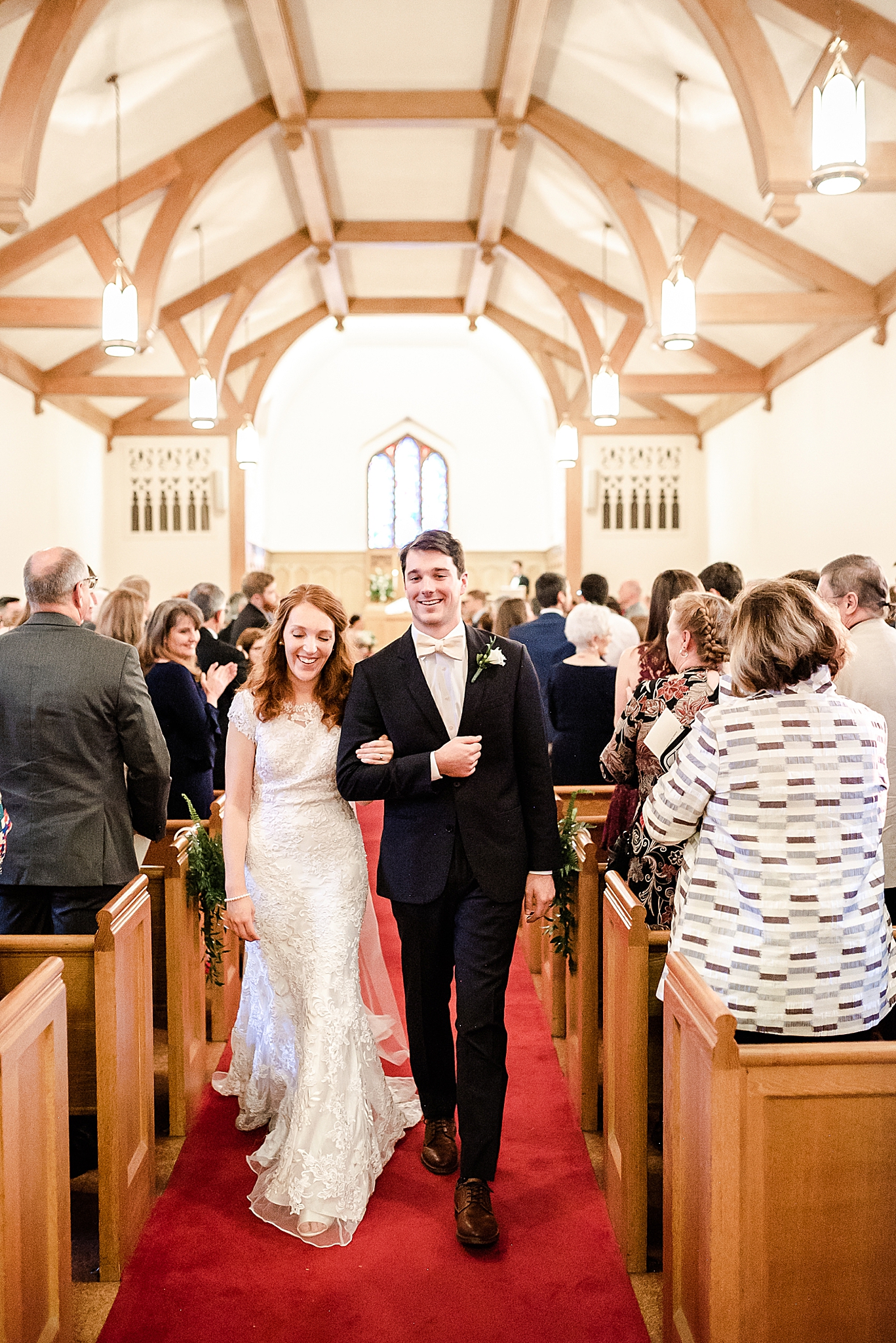 bride and groom leave traditional classic Southern wedding ceremony in local church
