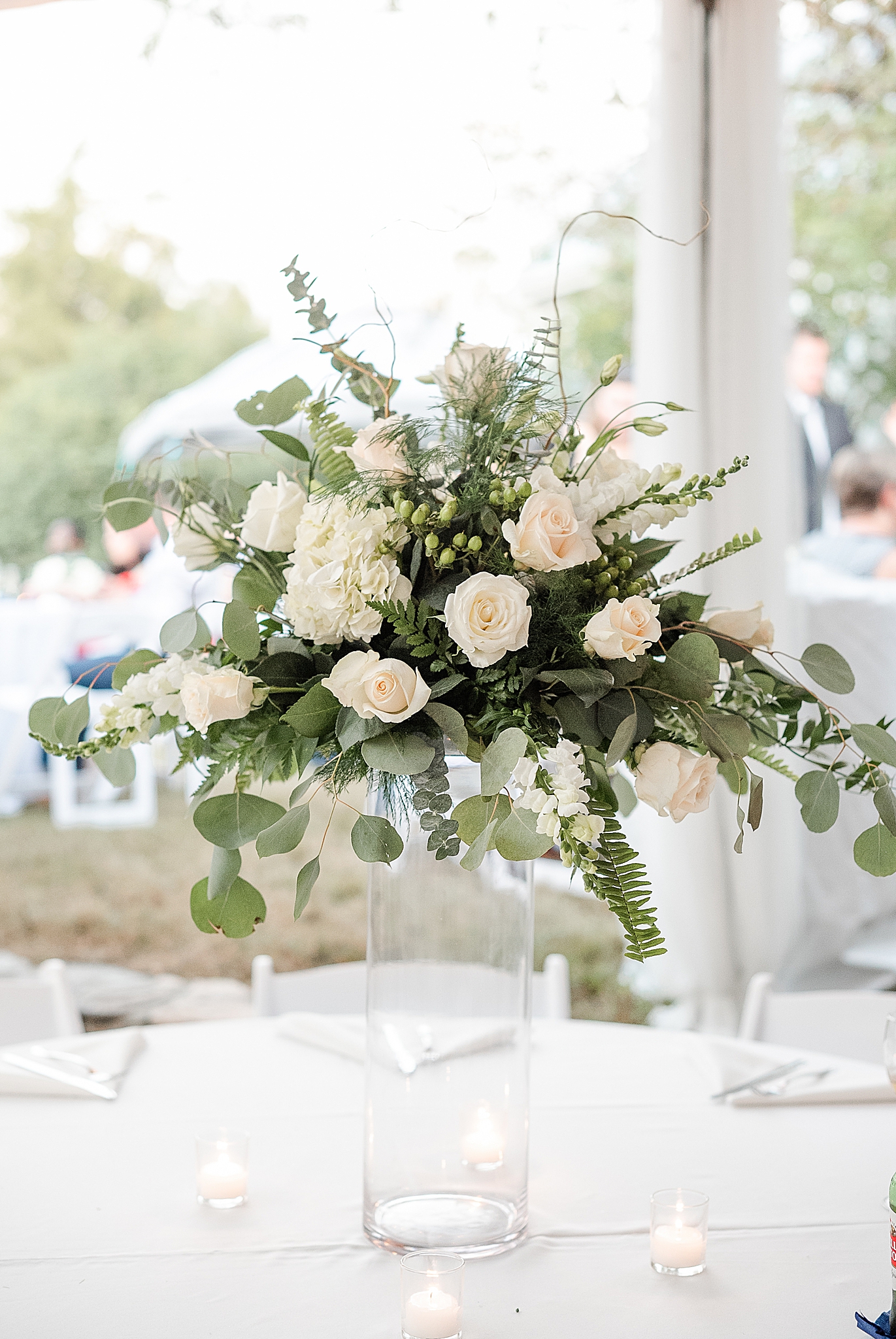 wedding centerpieces with ivory roses and greenery