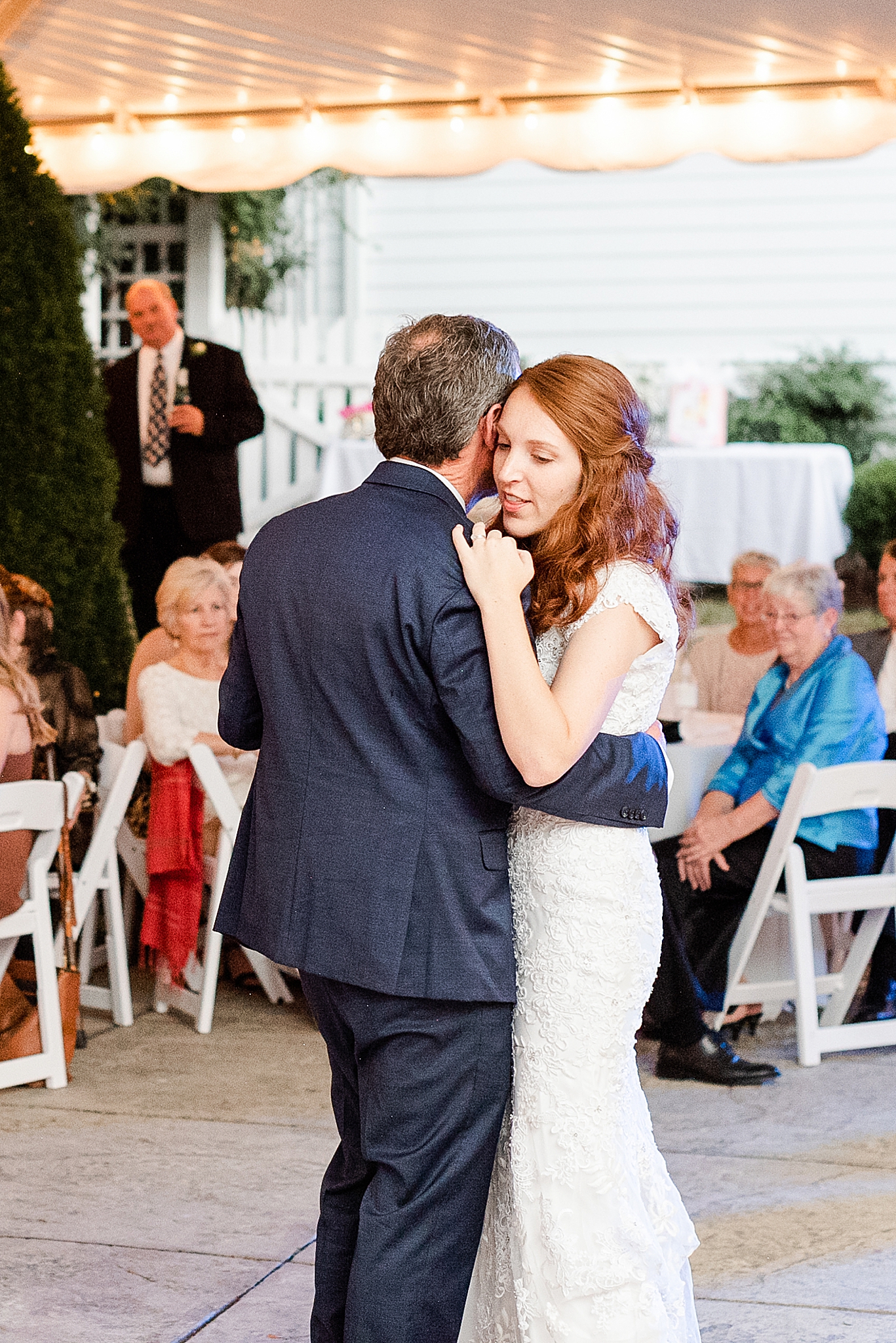 bride hugs father during dance at Lake O' The Woods Plantation wedding reception