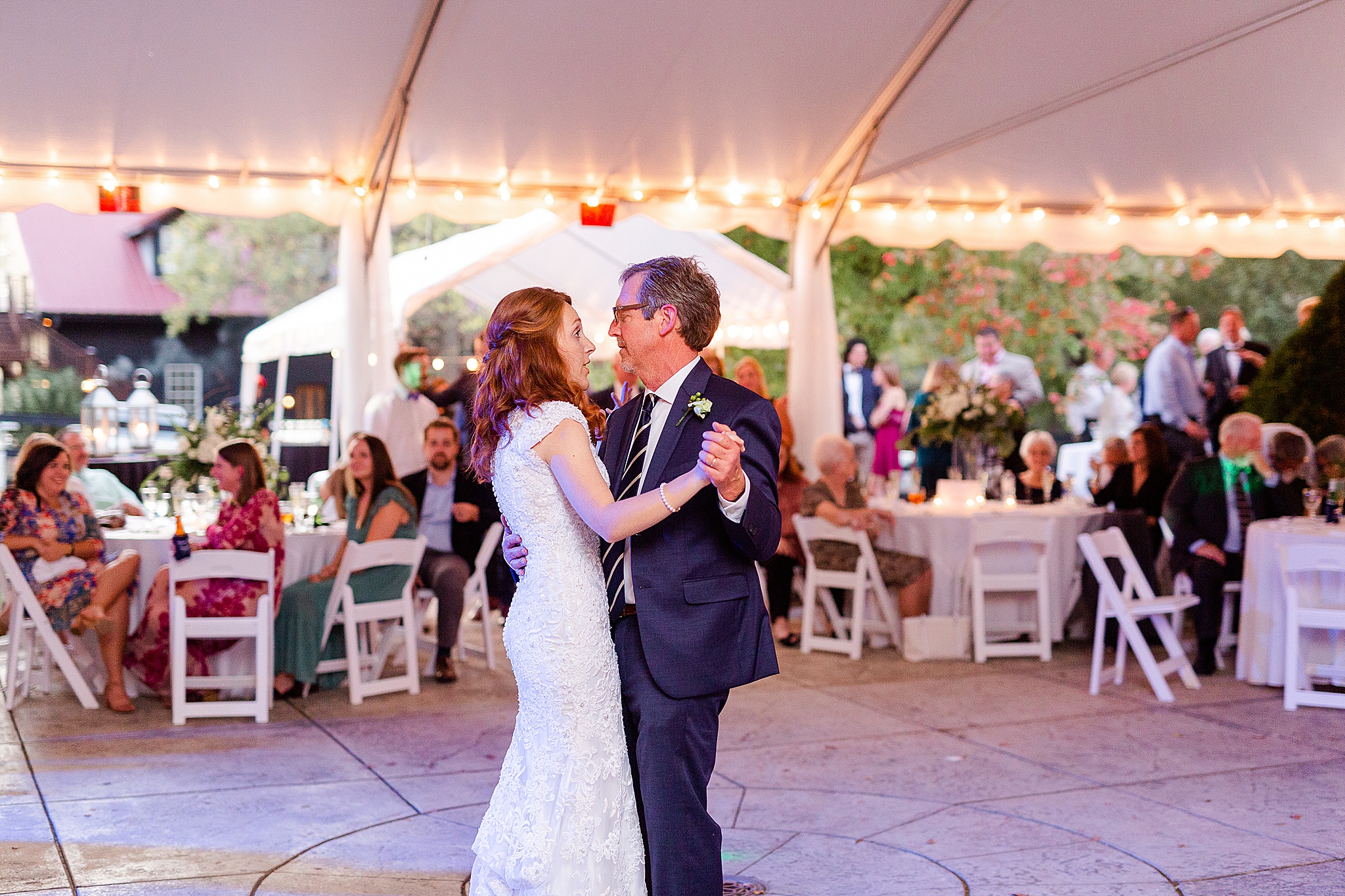 father-daughter dance under tent at Lake O' The Woods Plantation wedding reception