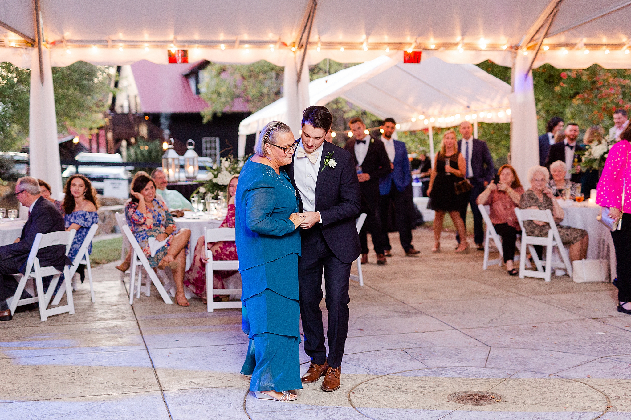 groom and mom dance during Lake O' The Woods Plantation wedding reception