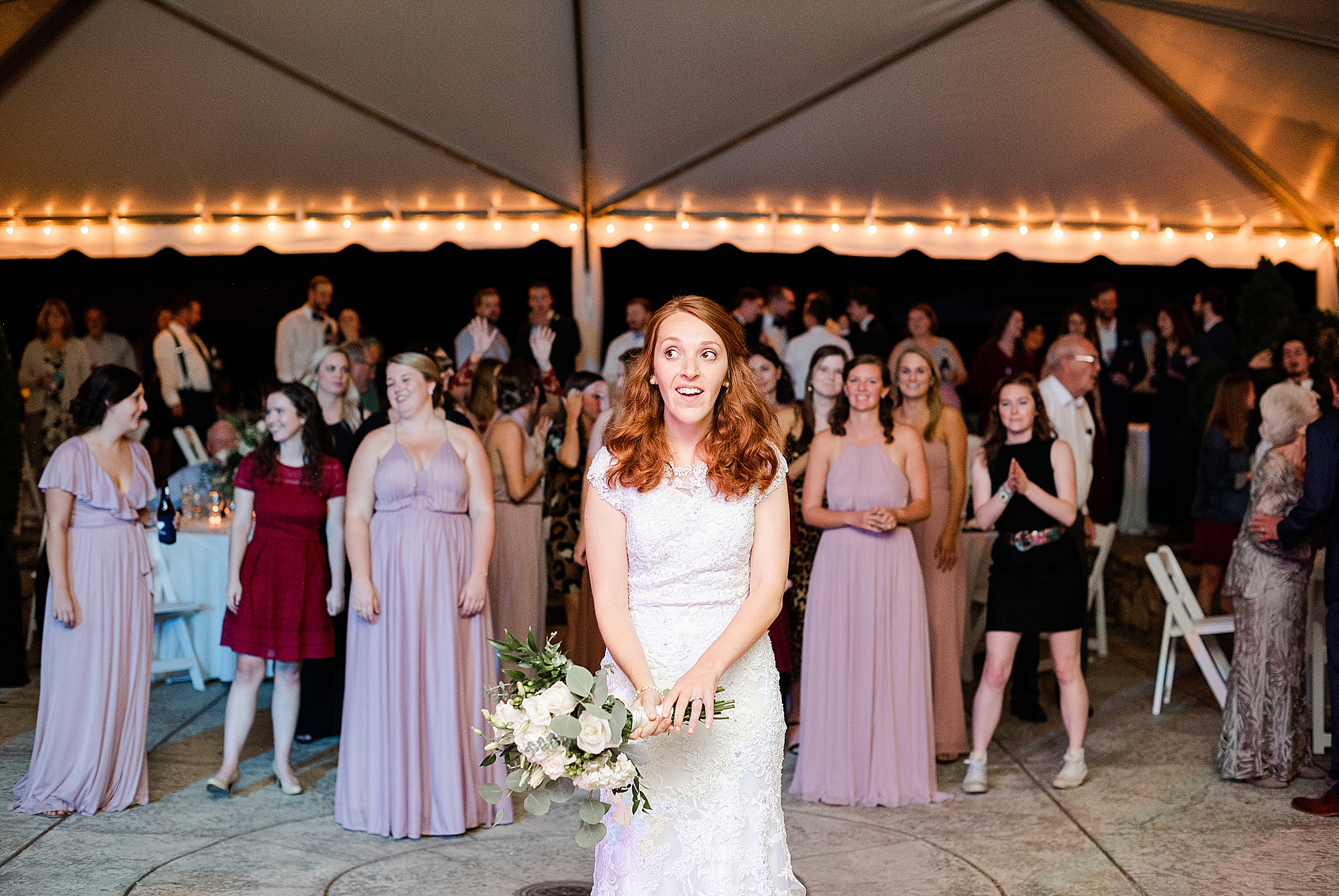 bride throws bouquet during Lake O' The Woods Plantation wedding reception