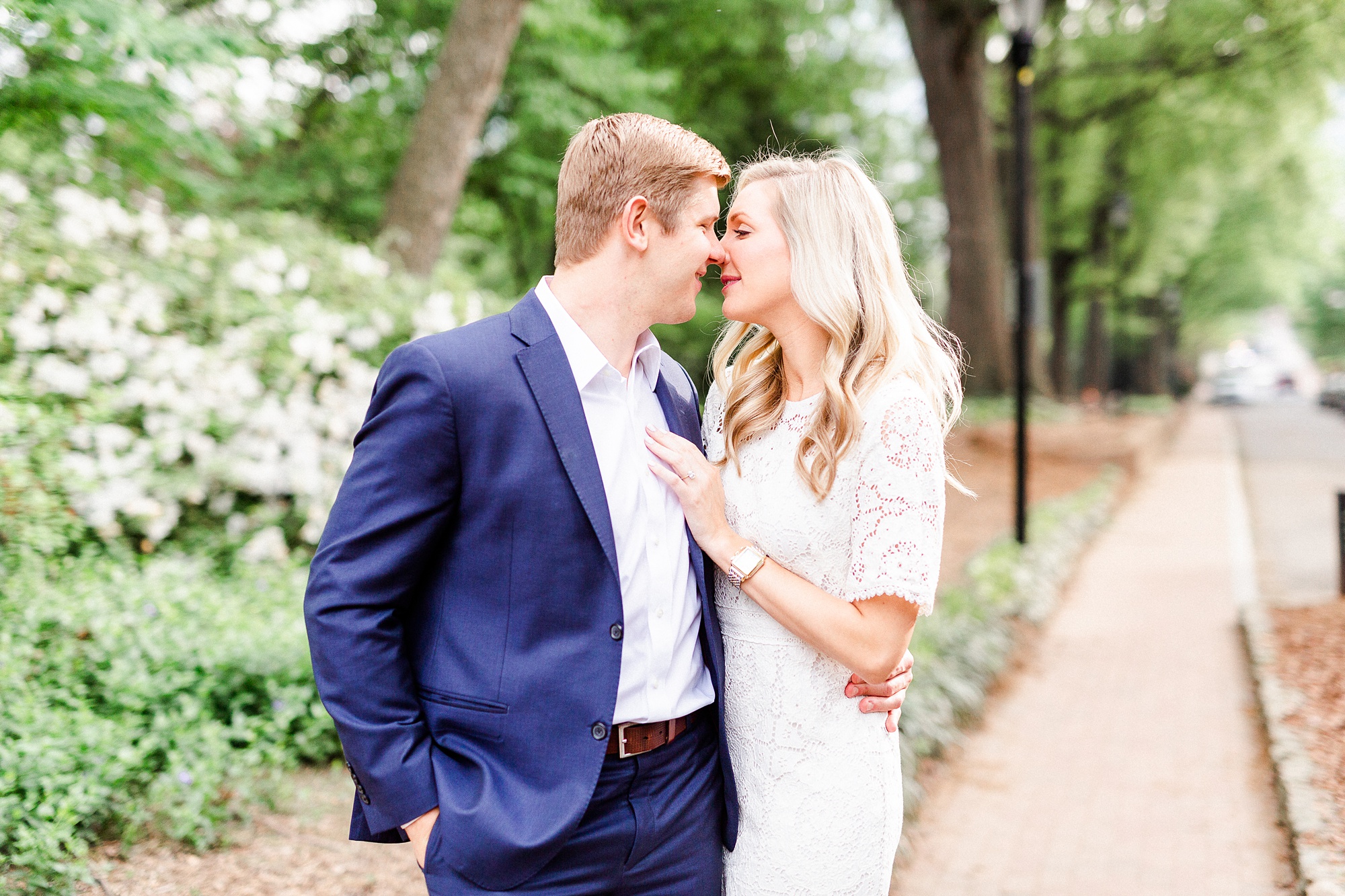 bride and groom stand nose to nose during stylish Charlotte engagement photos
