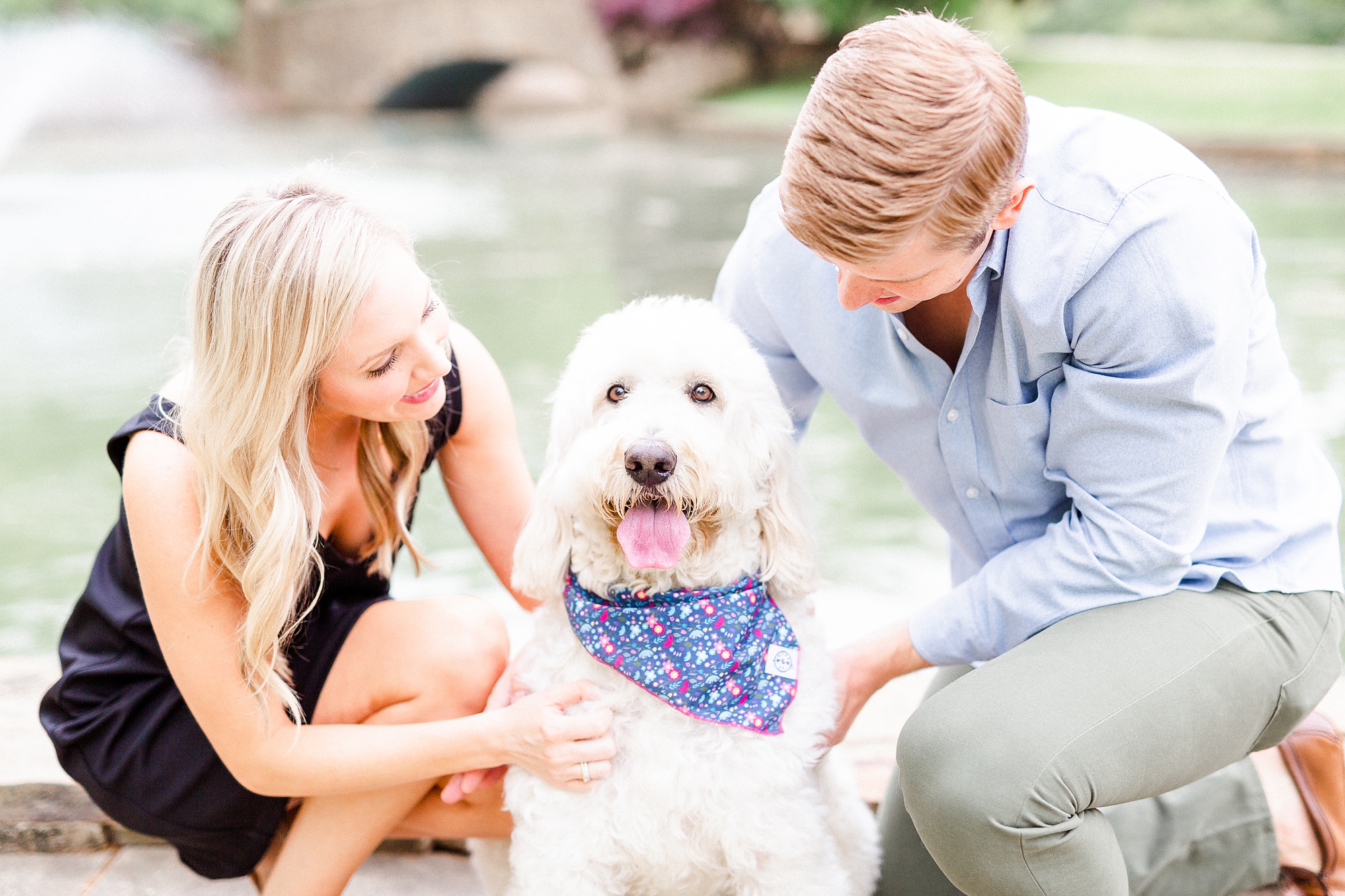 couple poses with dog during Freedom Park engagement photos