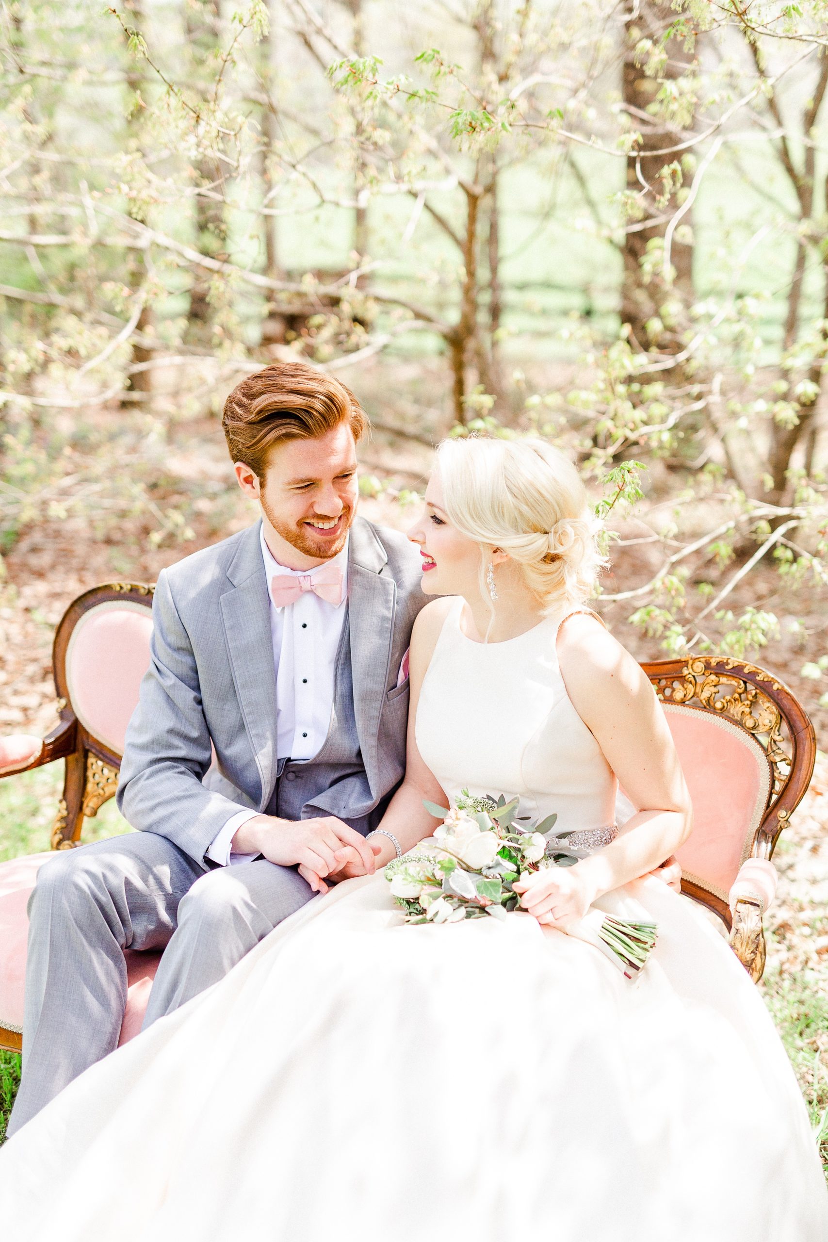 spring wedding portraits in Charlotte NC on pink couch