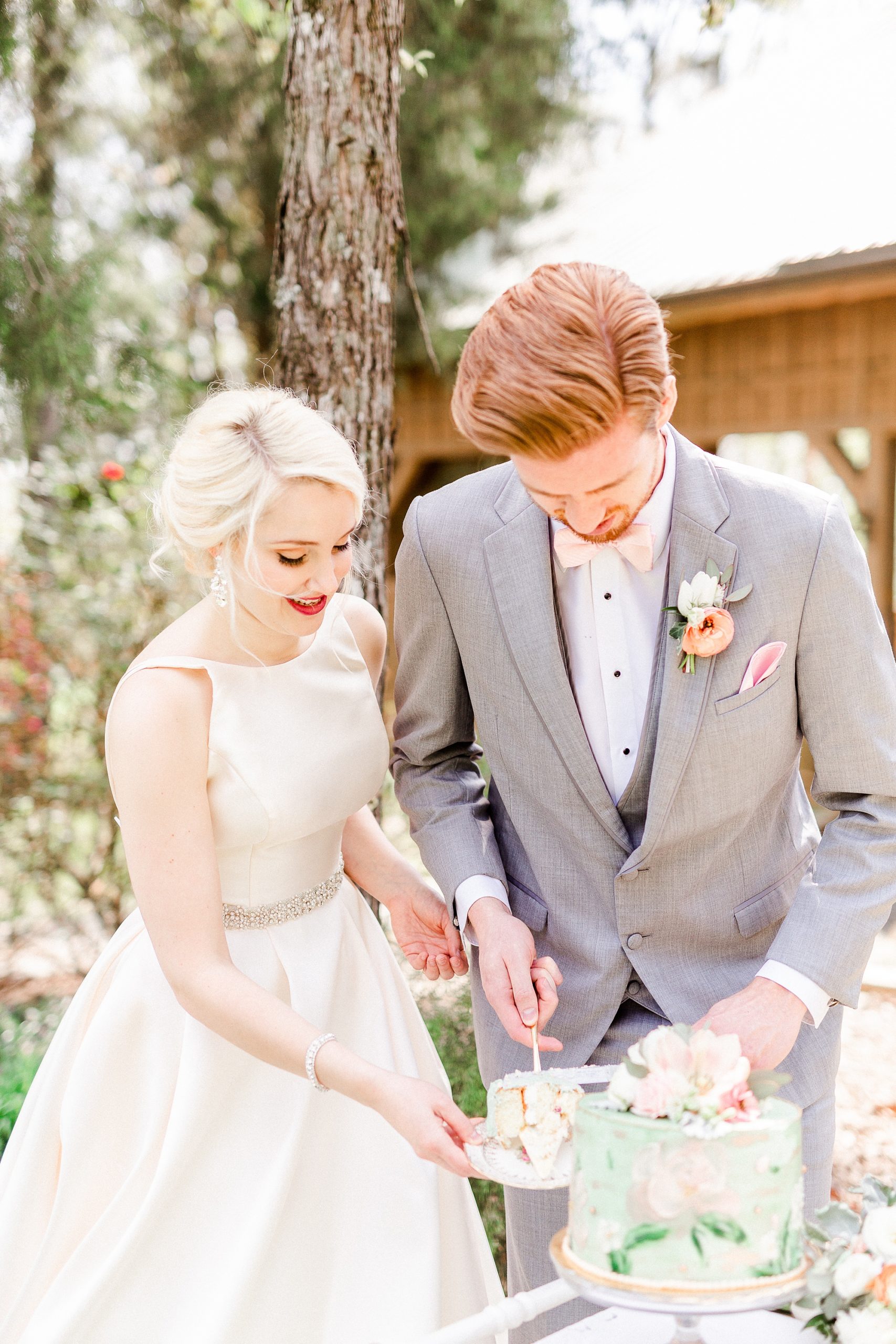 newlyweds cut wedding cake at Carolina Country Weddings