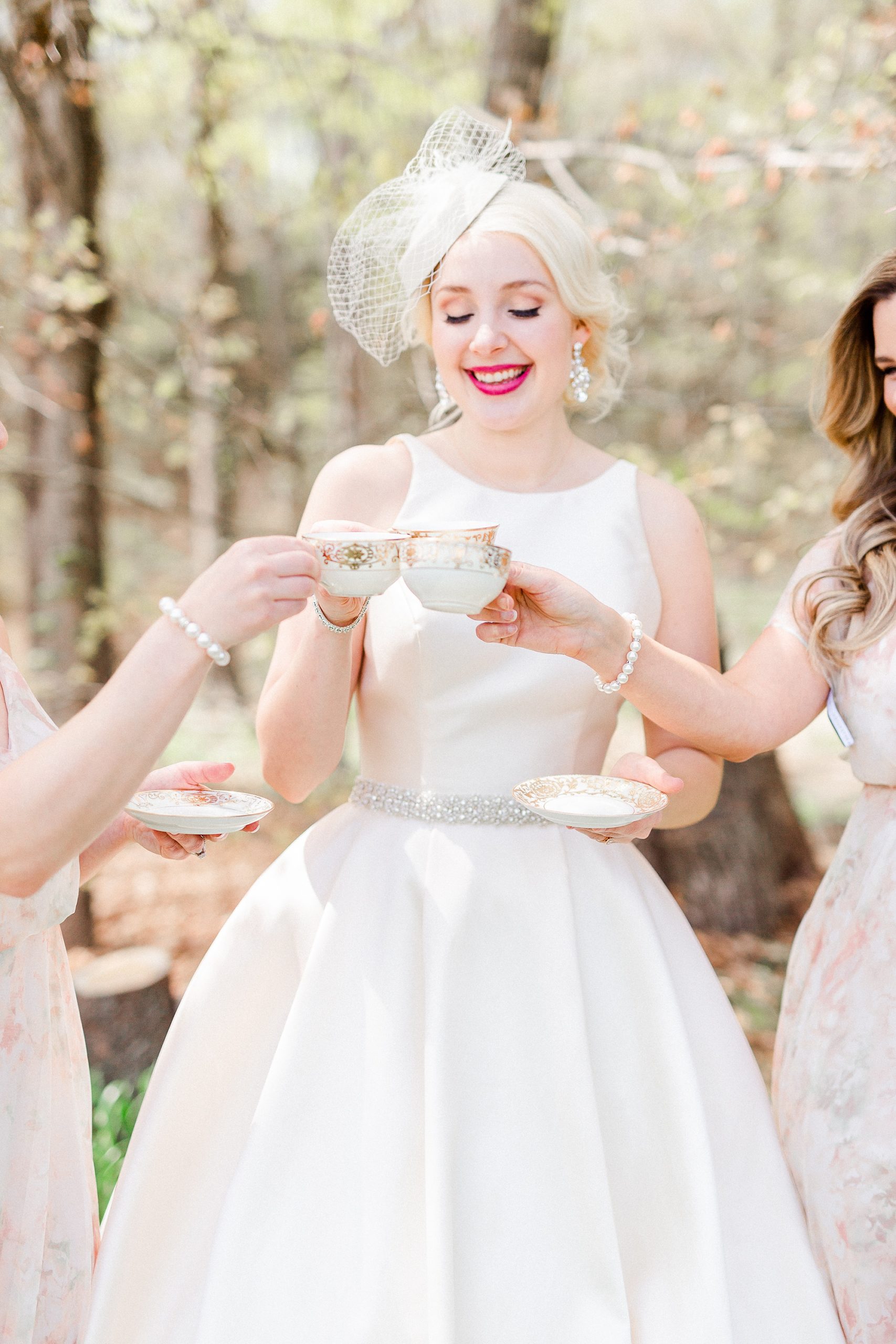 bride toasts with bridesmaids
