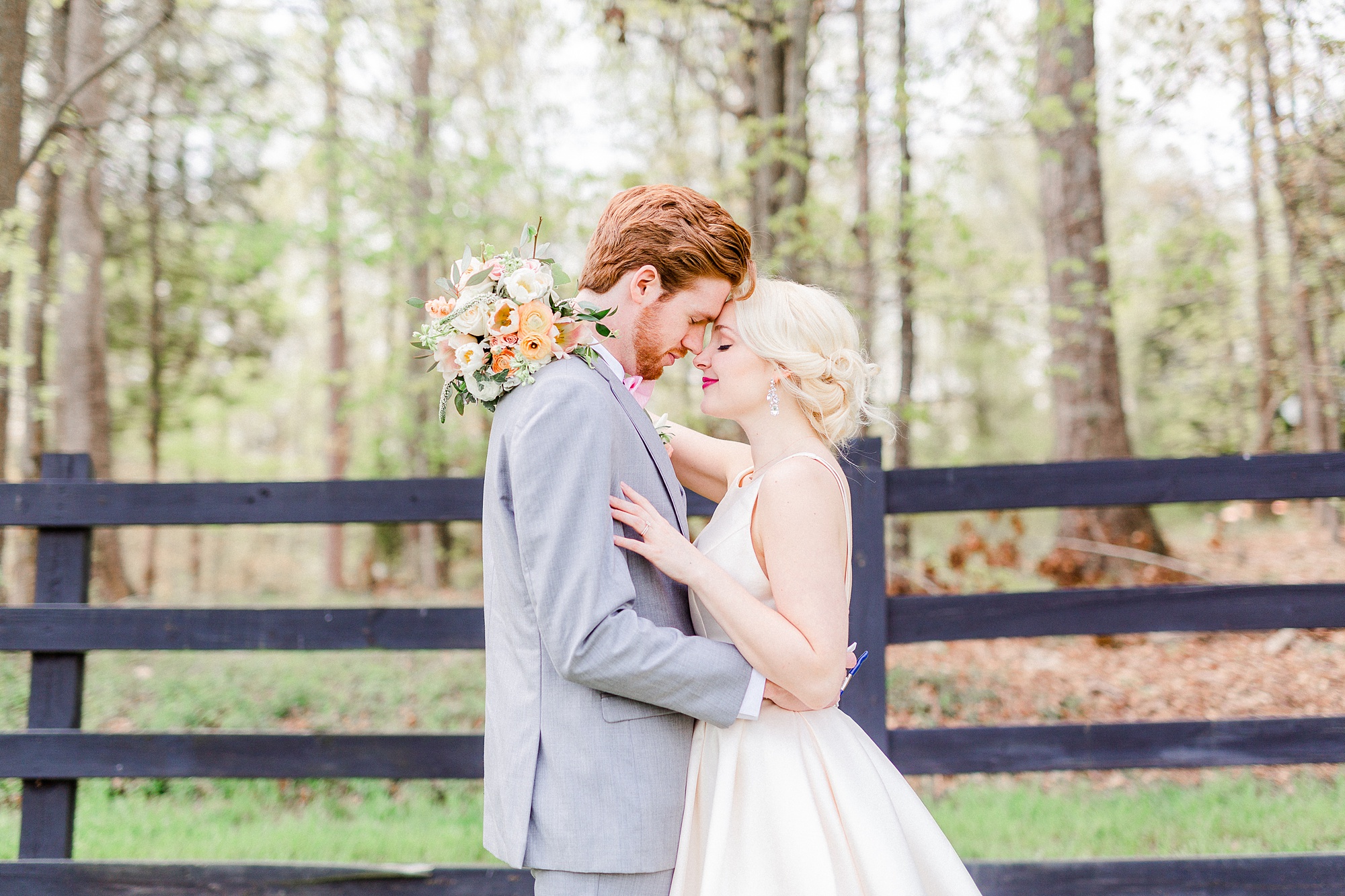 newlyweds stand nose to nose at Carolina Country Weddings