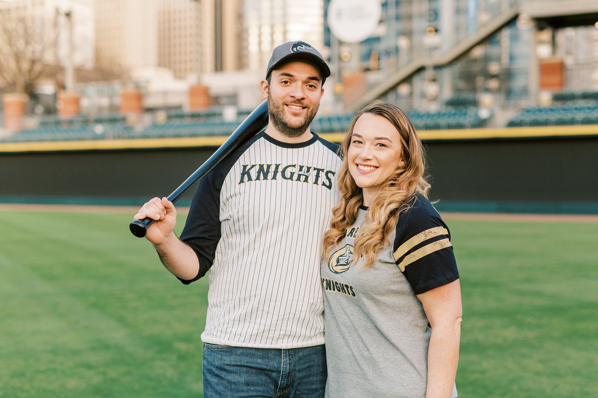 engagement session in Truist Field with couple in Knights t-shirts
