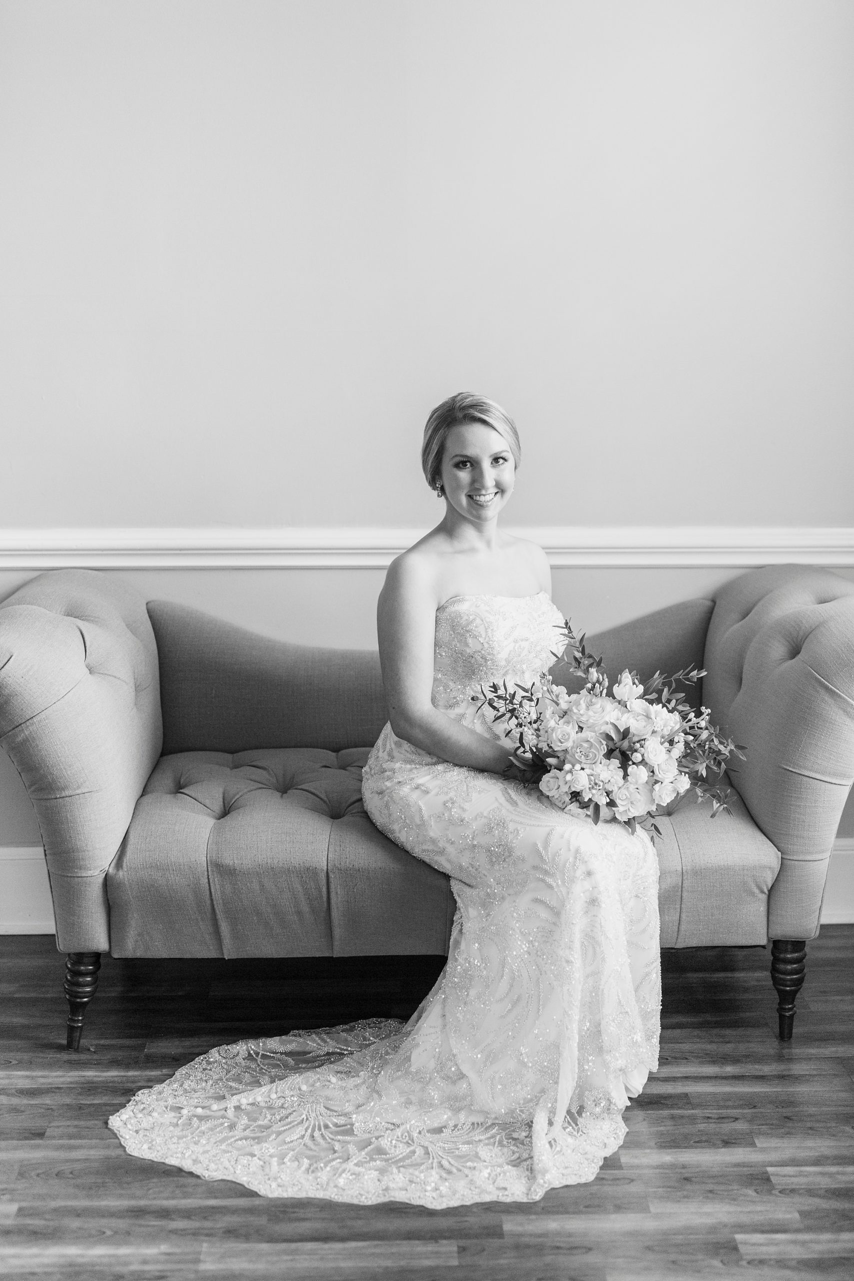 bride sits on couch in Separk Mansion
