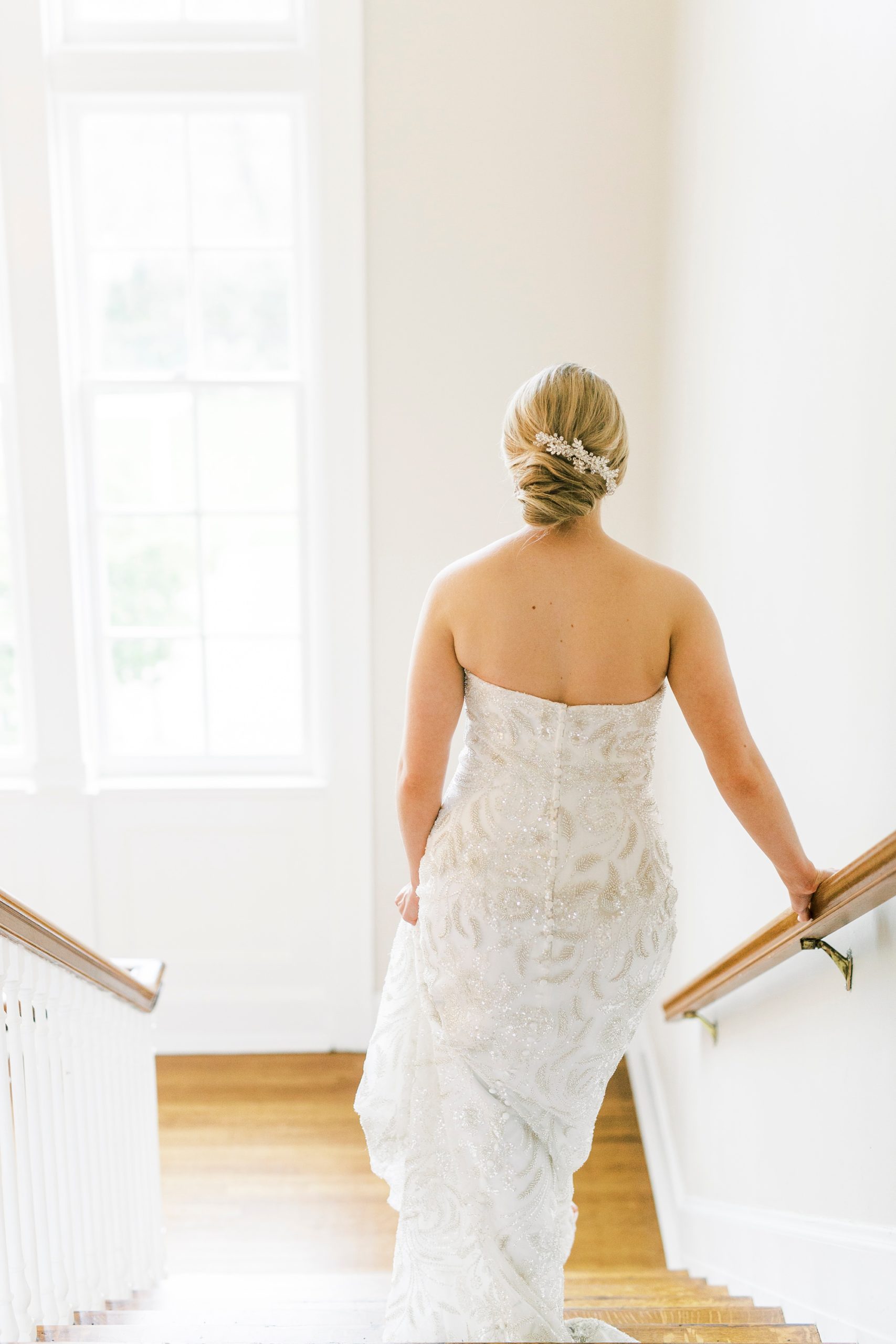 bride walks down staircase at Separk Mansion