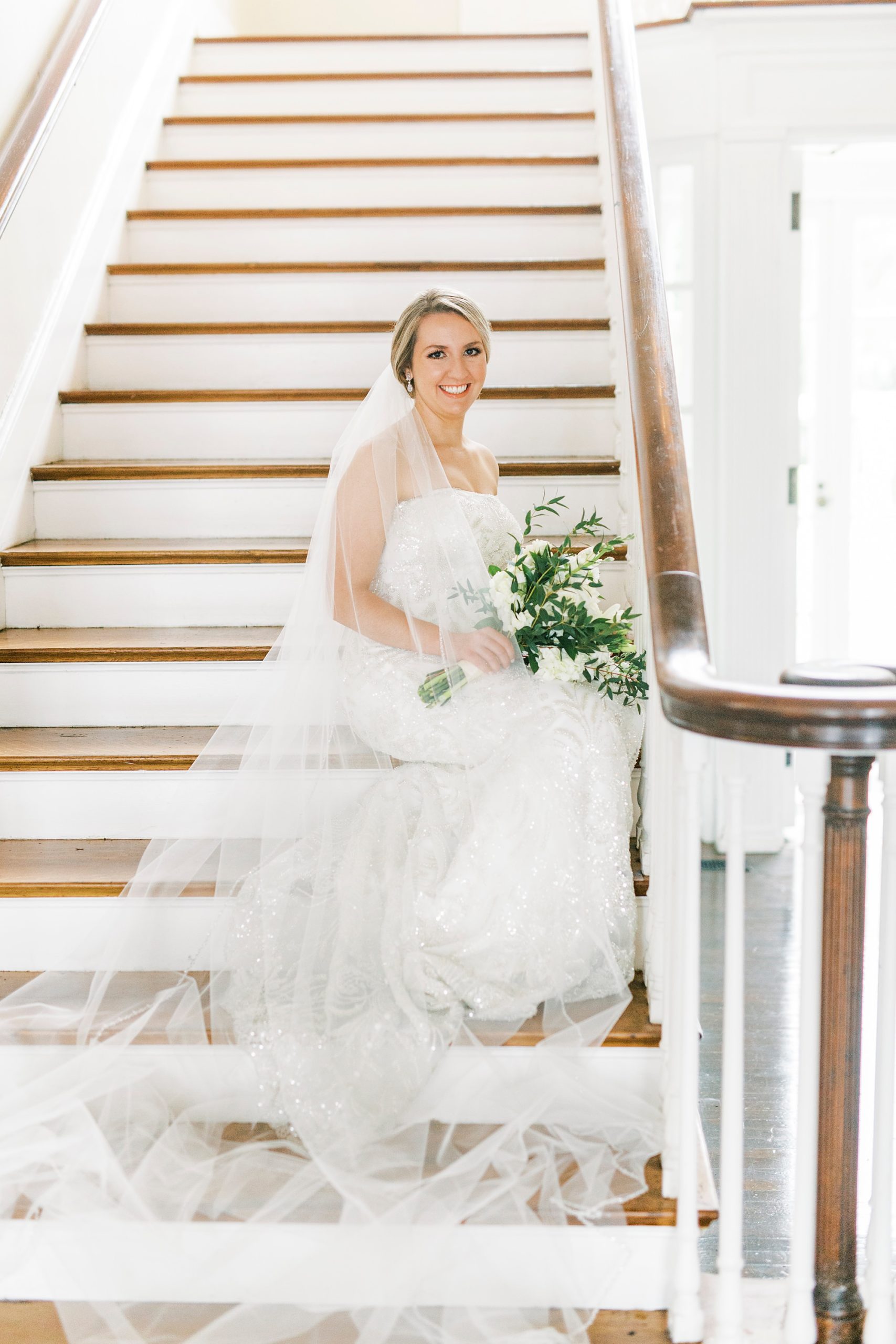 bride sits on staircase in Separk Mansion