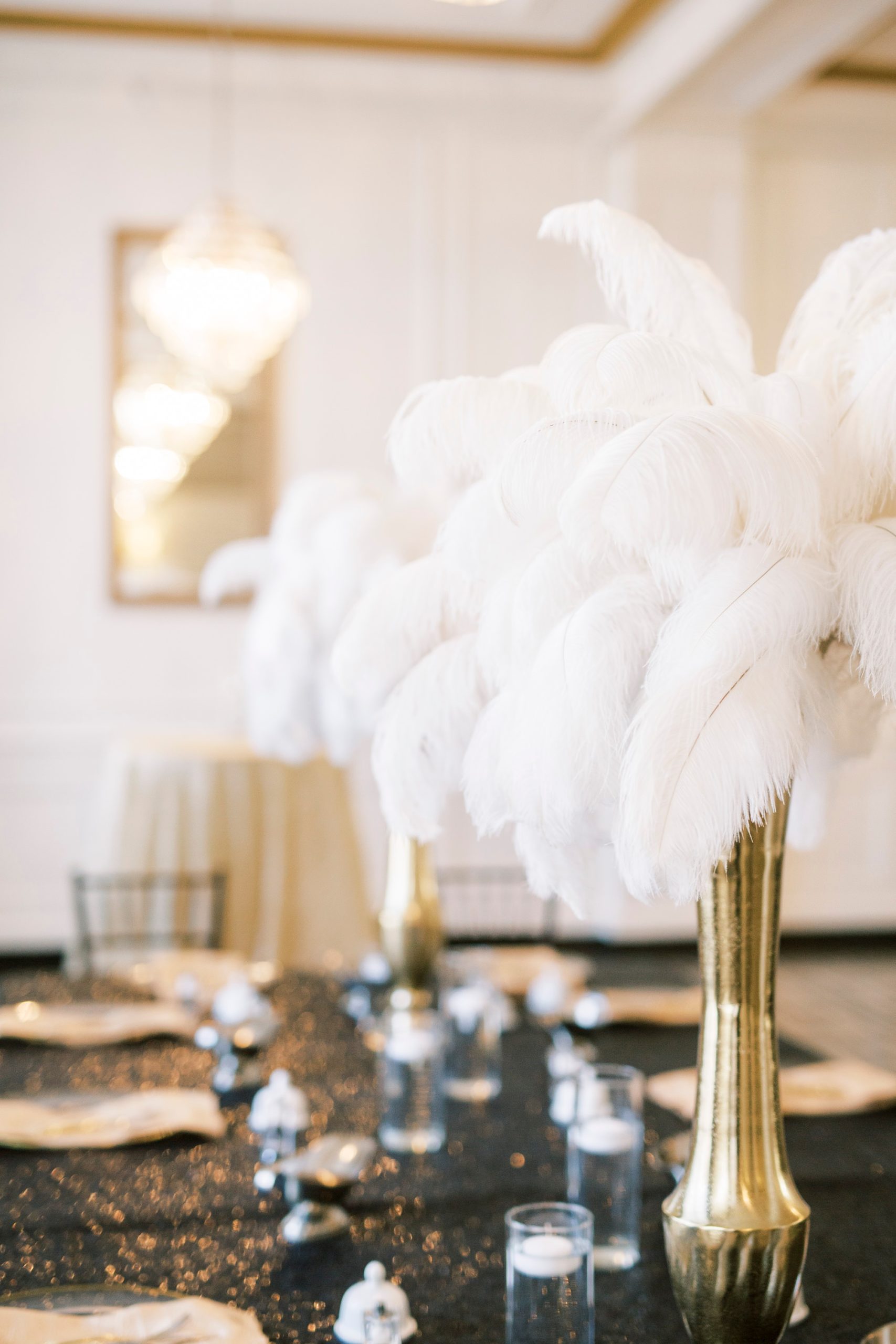 feathered centerpieces for black and gold Great Gatsby birthday party