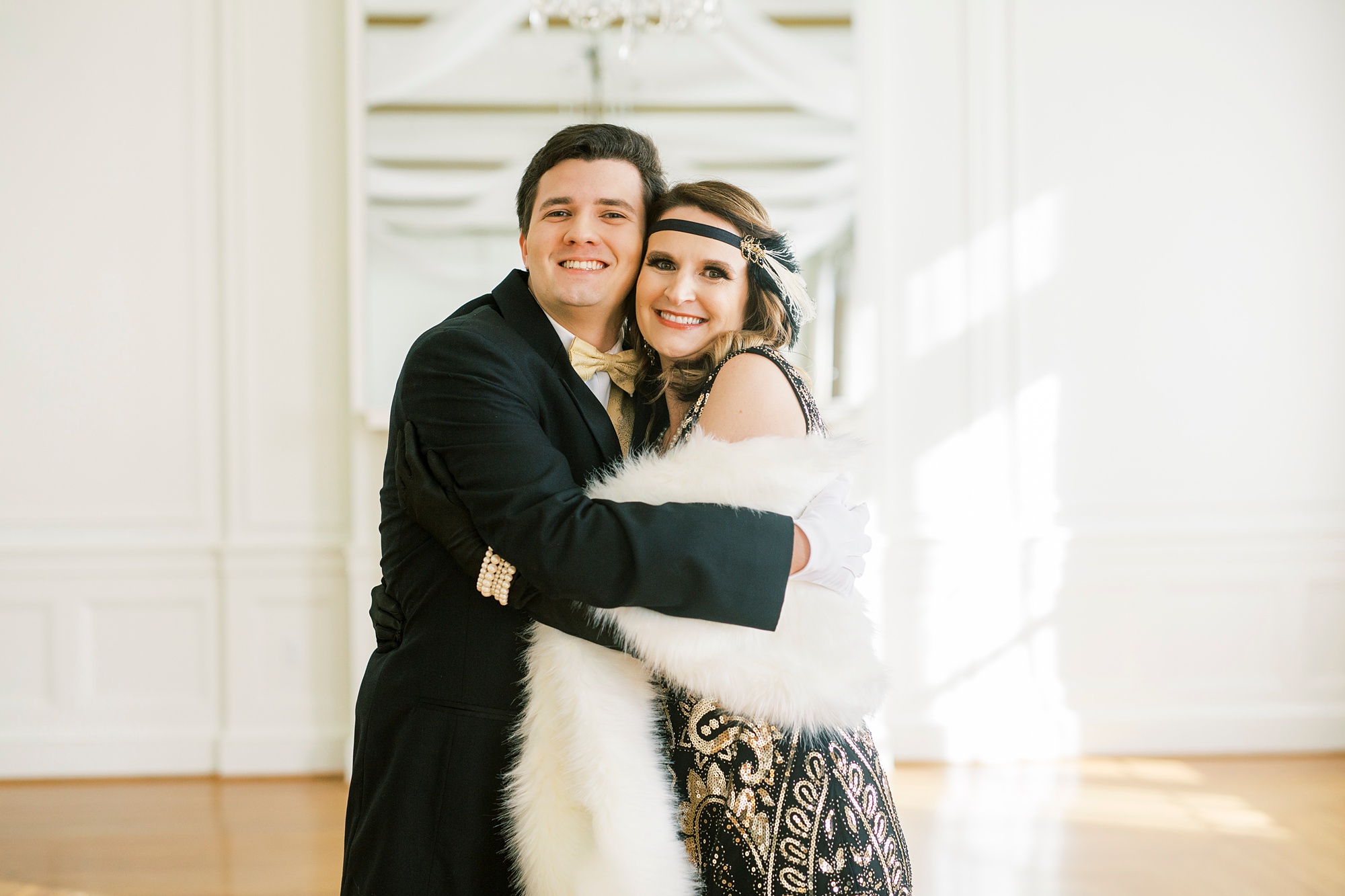 son hugs mom during Great Gatsby birthday party
