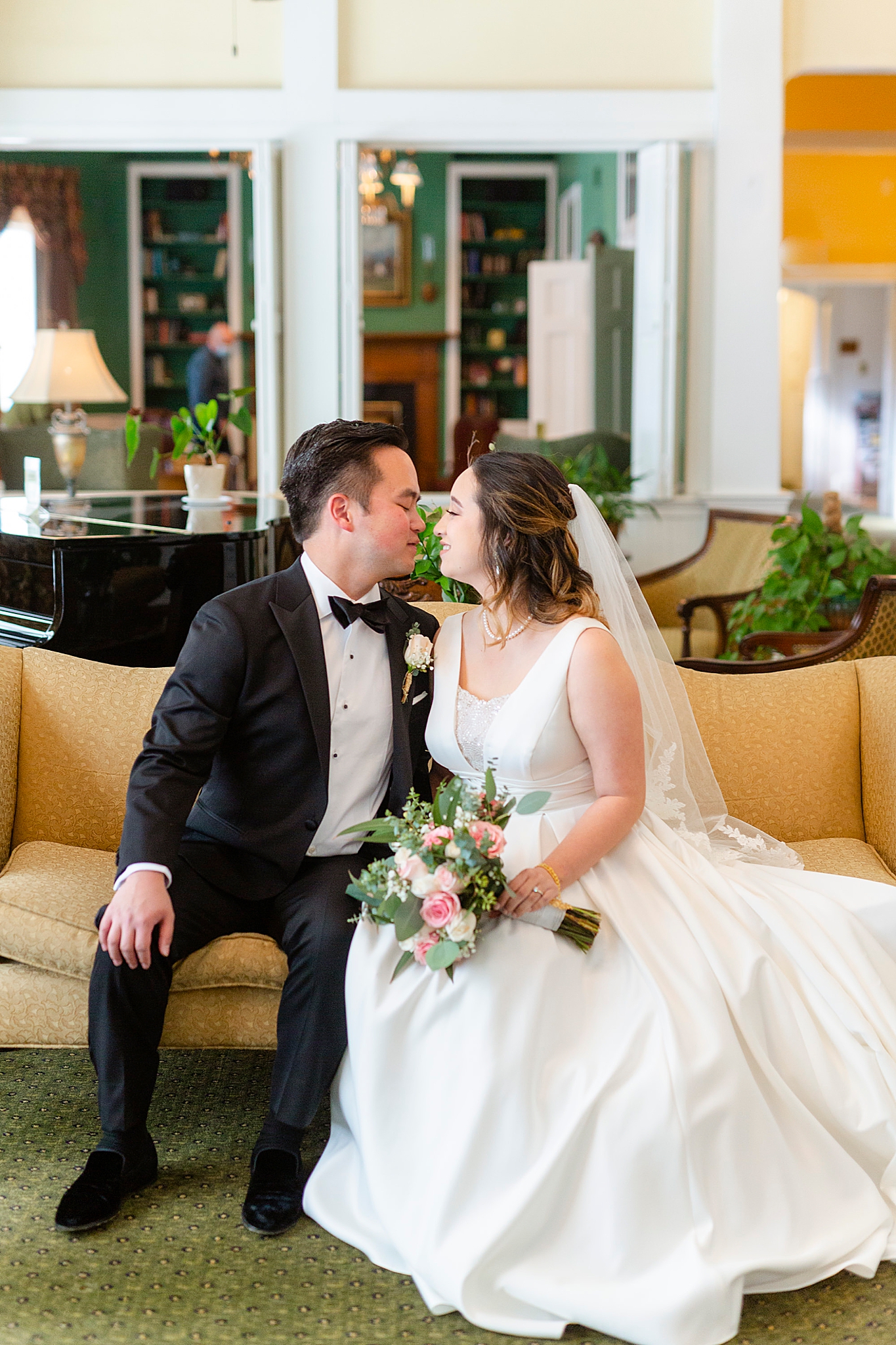 bride and groom kiss in library at Green Park Inn