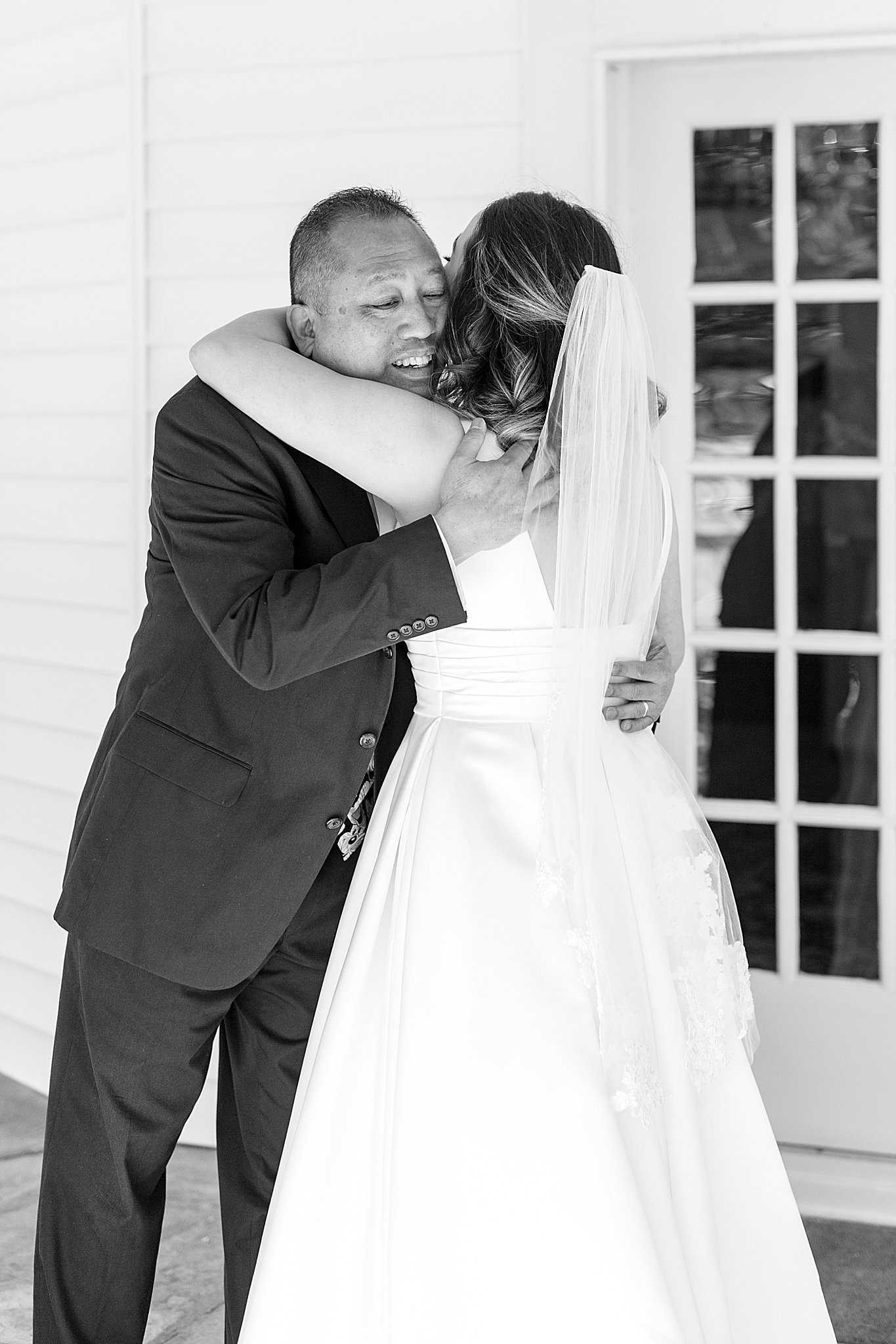 bride and dad hug during first look