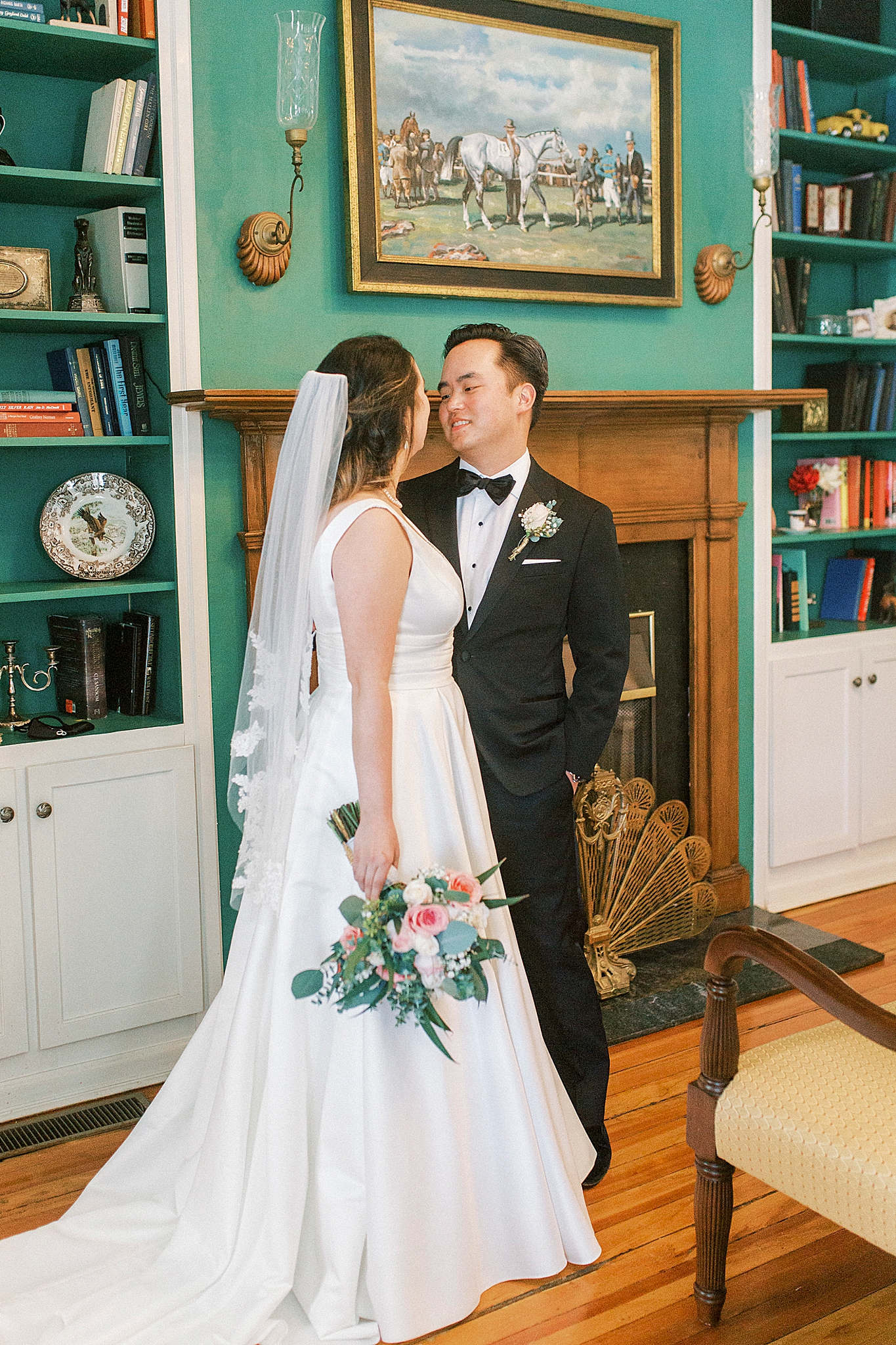 bride and groom pose in library at Green Park Inn