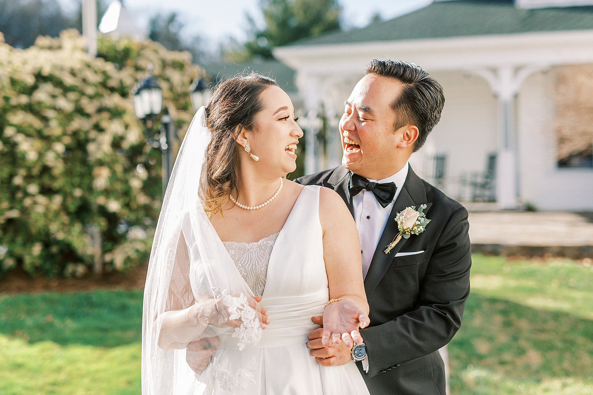 bride and groom laugh together during NC wedding photos