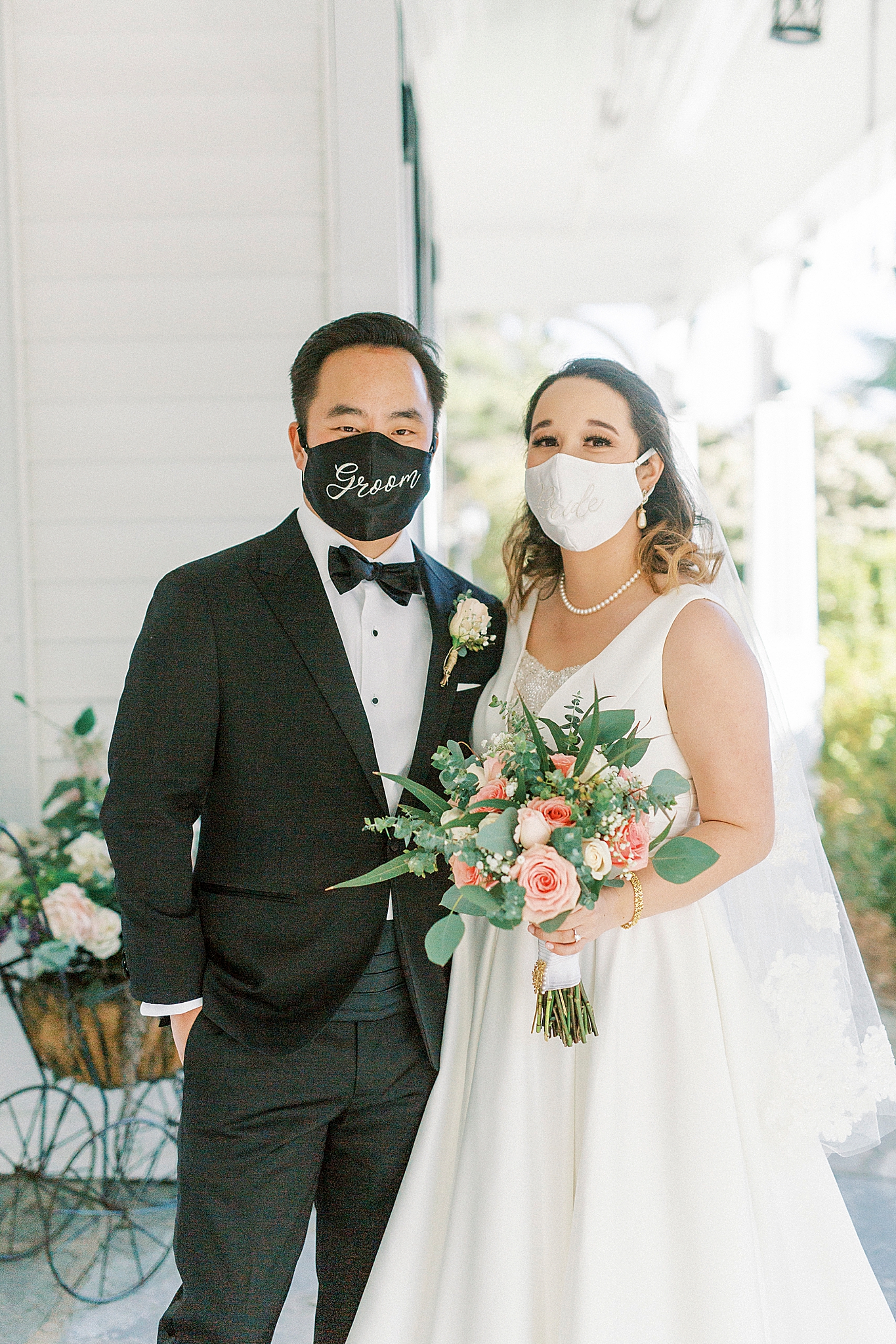 newlyweds pose in Bride and Groom masks