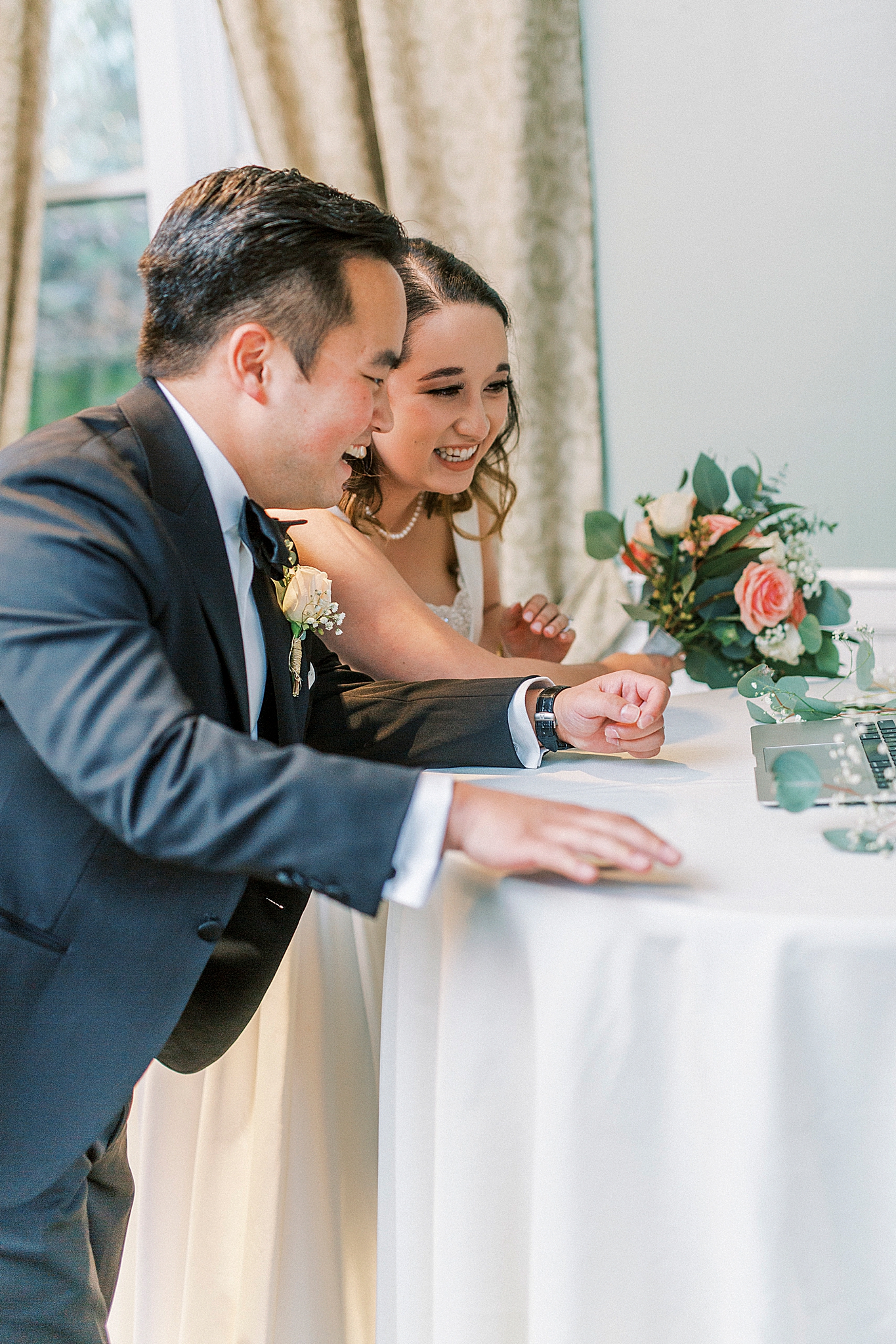 newlyweds talk to Zoom guests on laptop