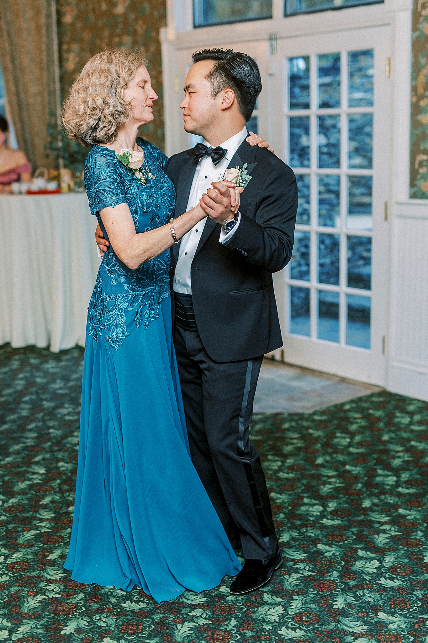 groom and mother dance during NC wedding reception