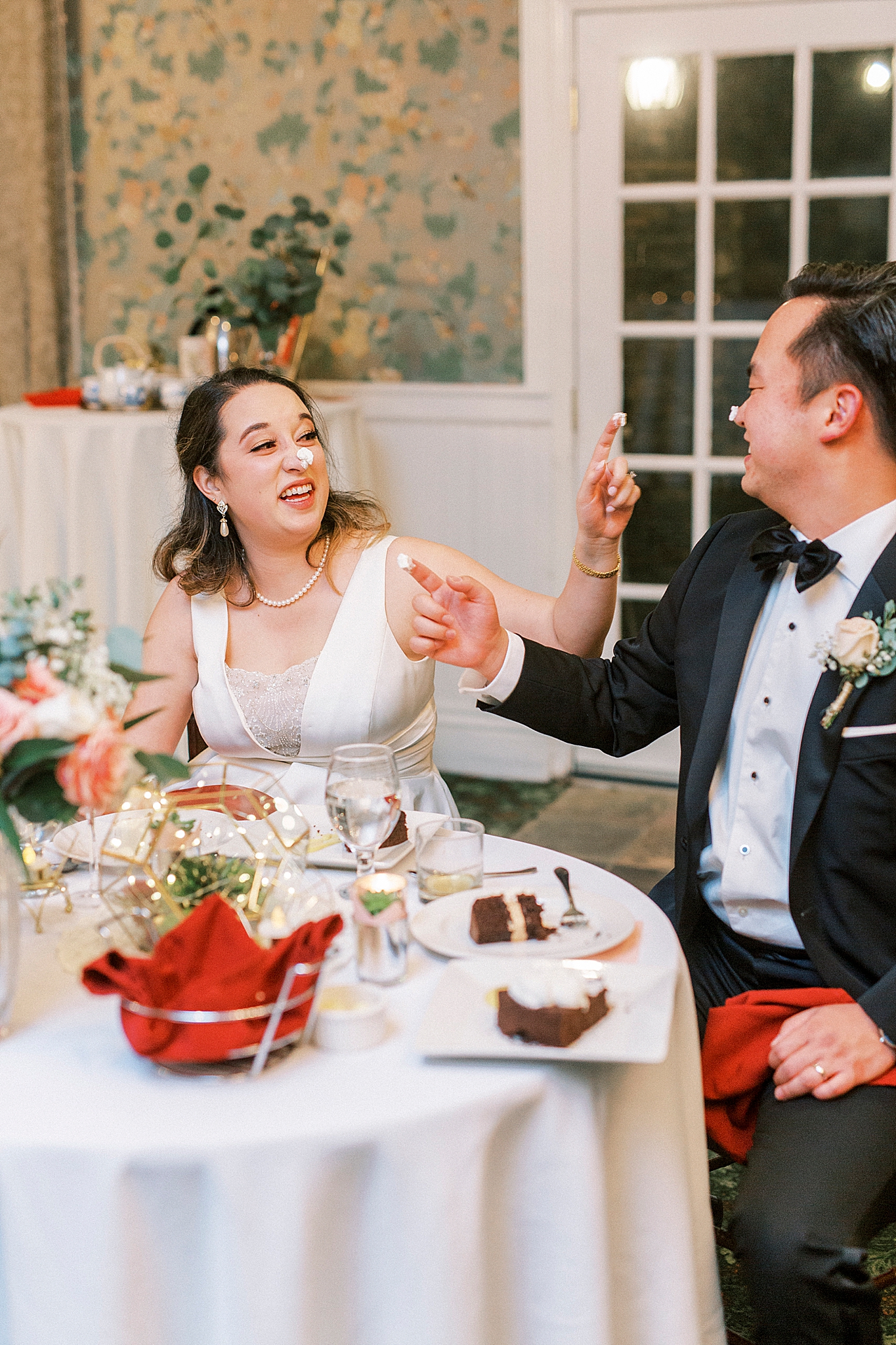 newlyweds feed each other cake