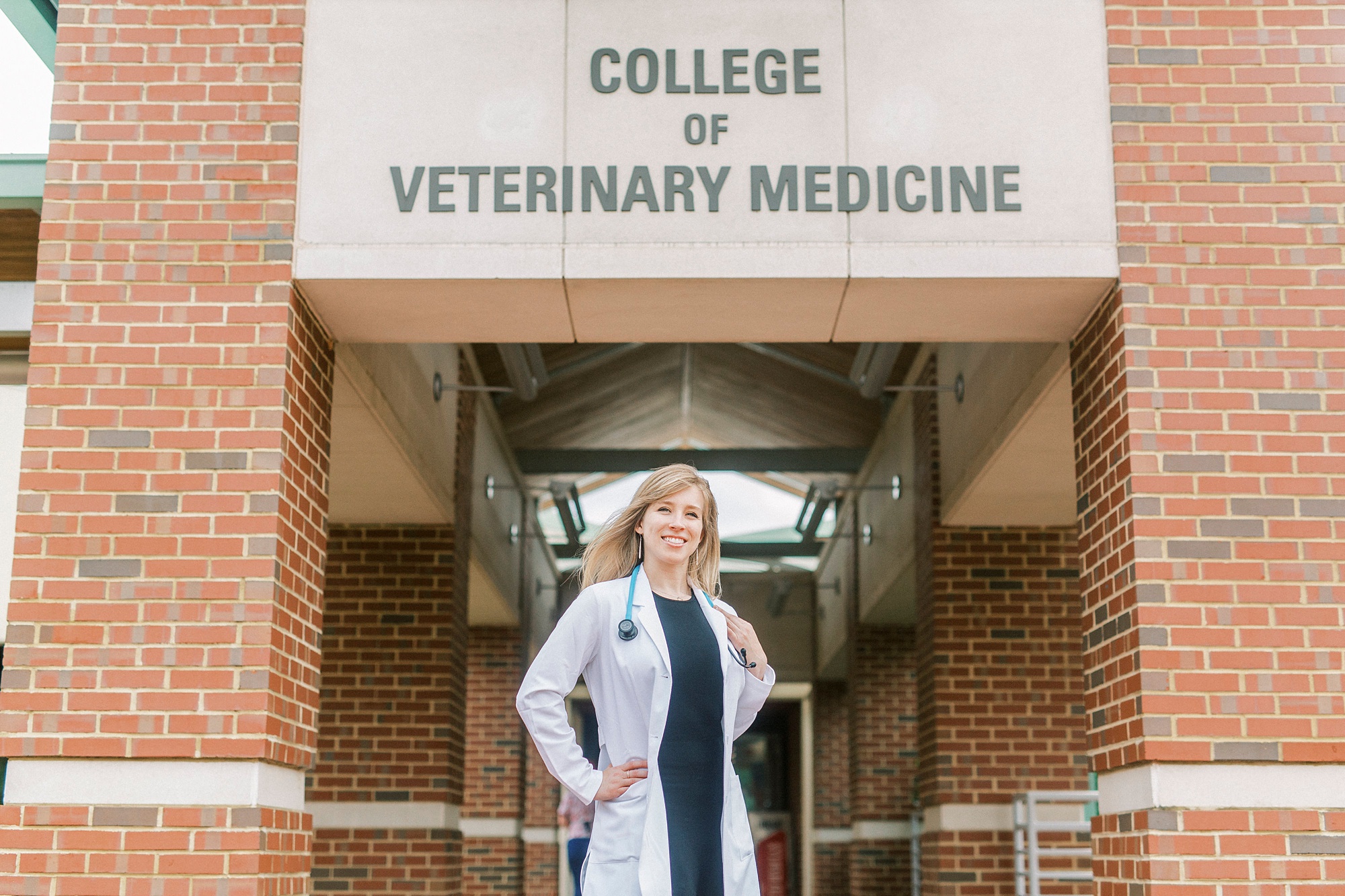 College of Veterinary Medicine senior portraits for student in white coat