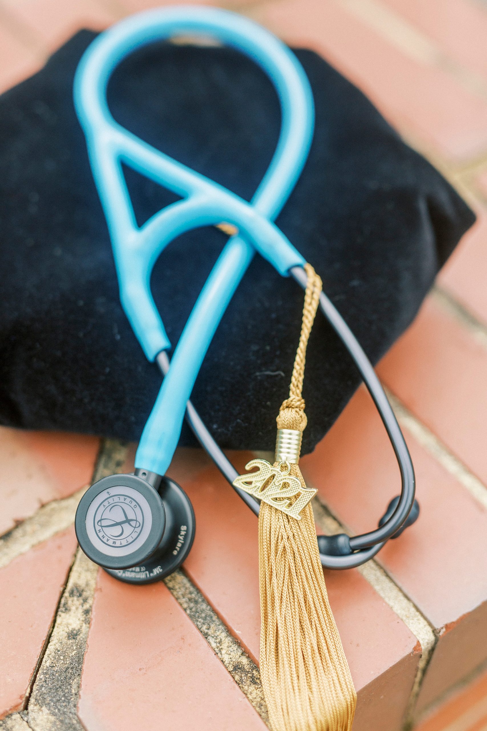 stethoscope for doctor lays on graduation hat