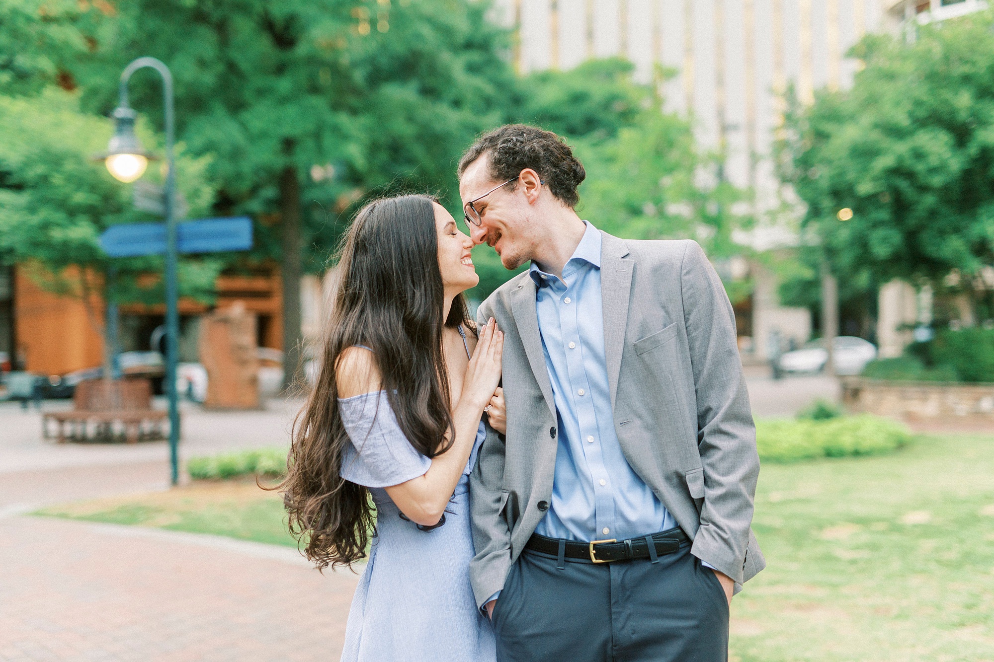 bride and groom touch noses during The Green Charlotte engagement session