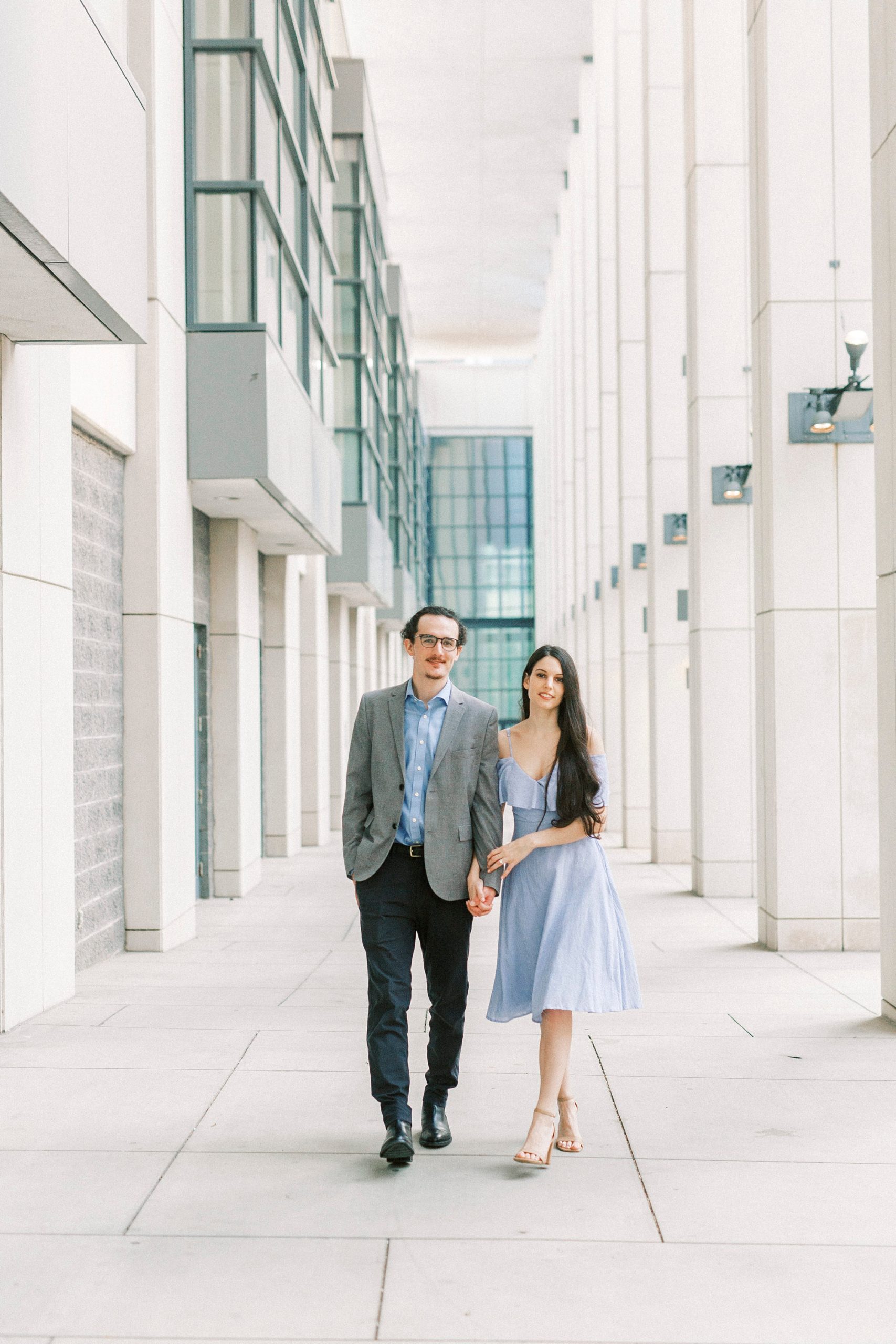 bride and groom pose during Uptown Charlotte engagement photos