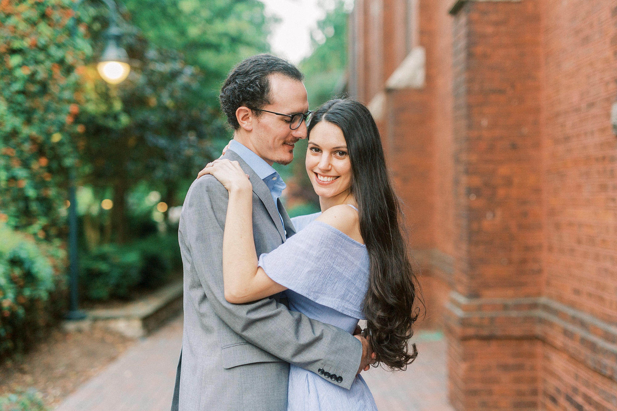 Uptown Charlotte engagement session by brick building