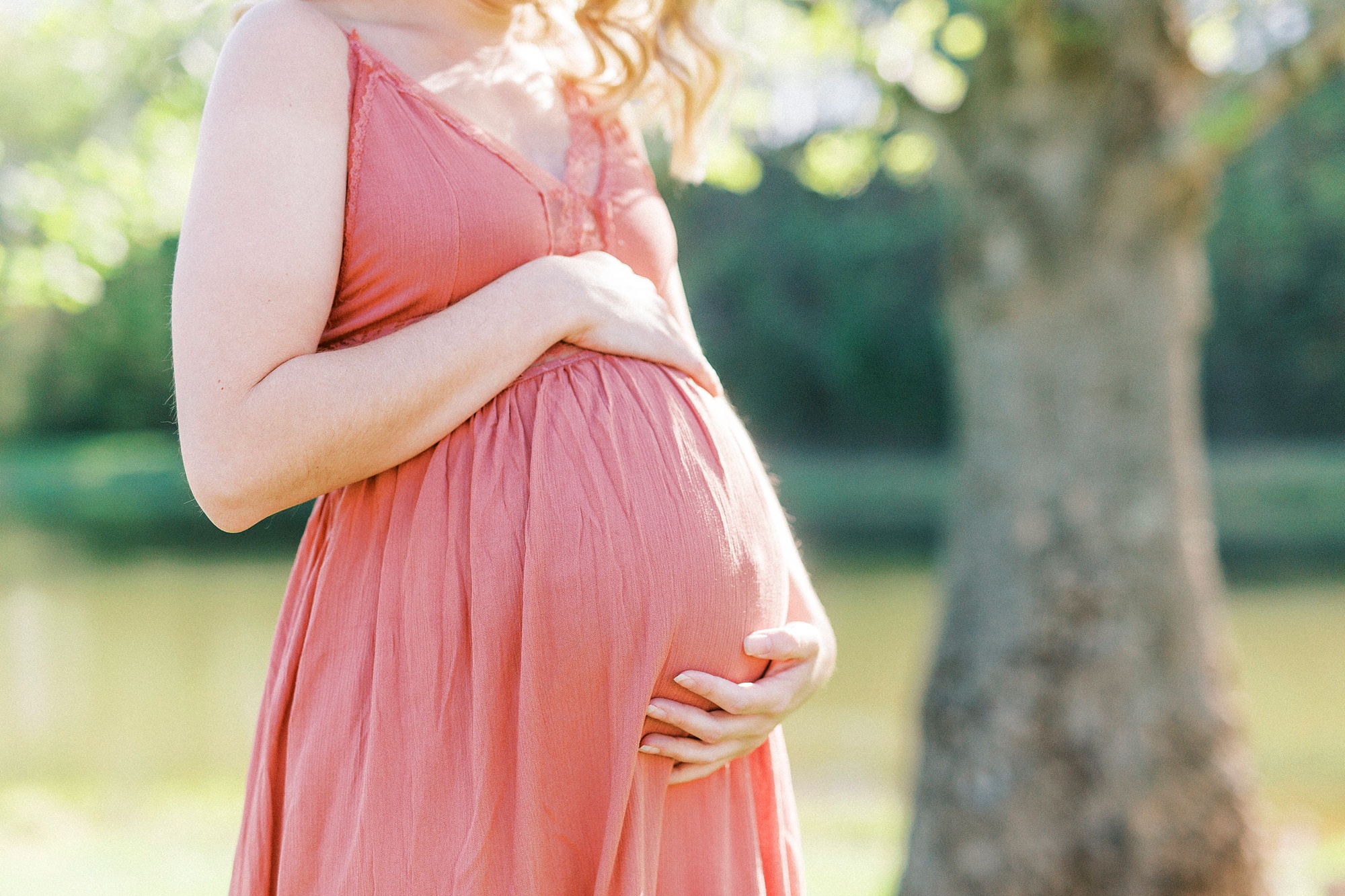 Winston-Salem maternity photos for expecting mom in pink sundress