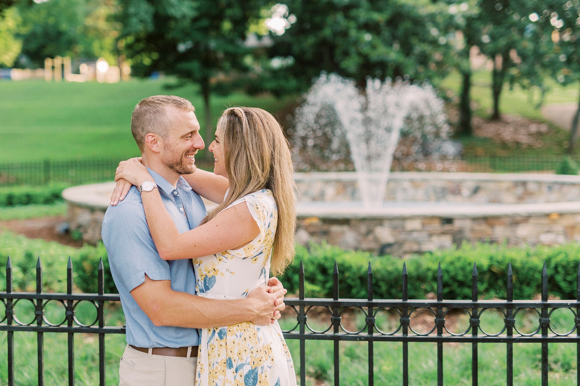 sunset engagement portraits along fountain in Downtown Belmont