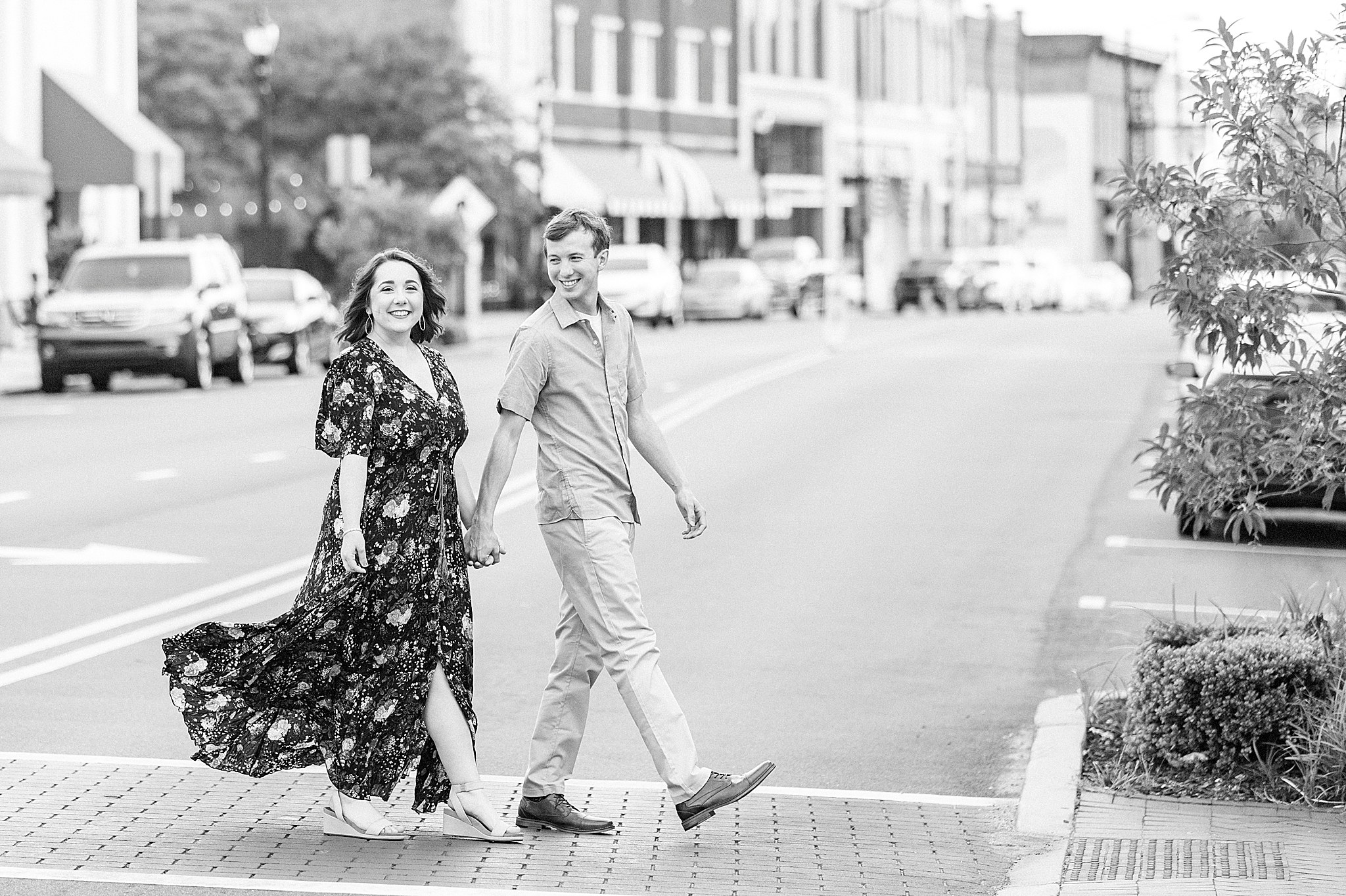 couple walks down street during anniversary portraits
