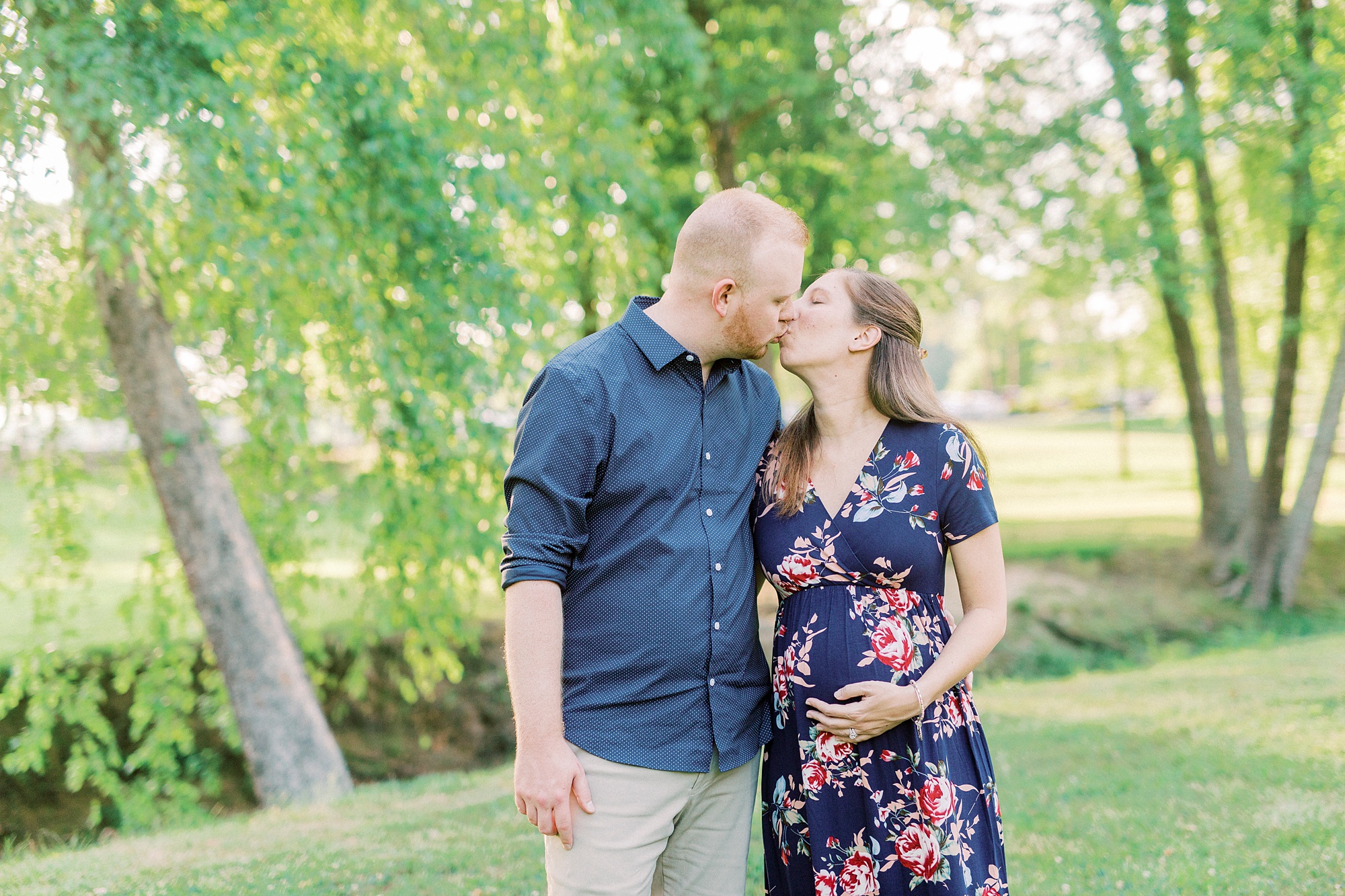 married couple kisses during Rankin Lake Park maternity session
