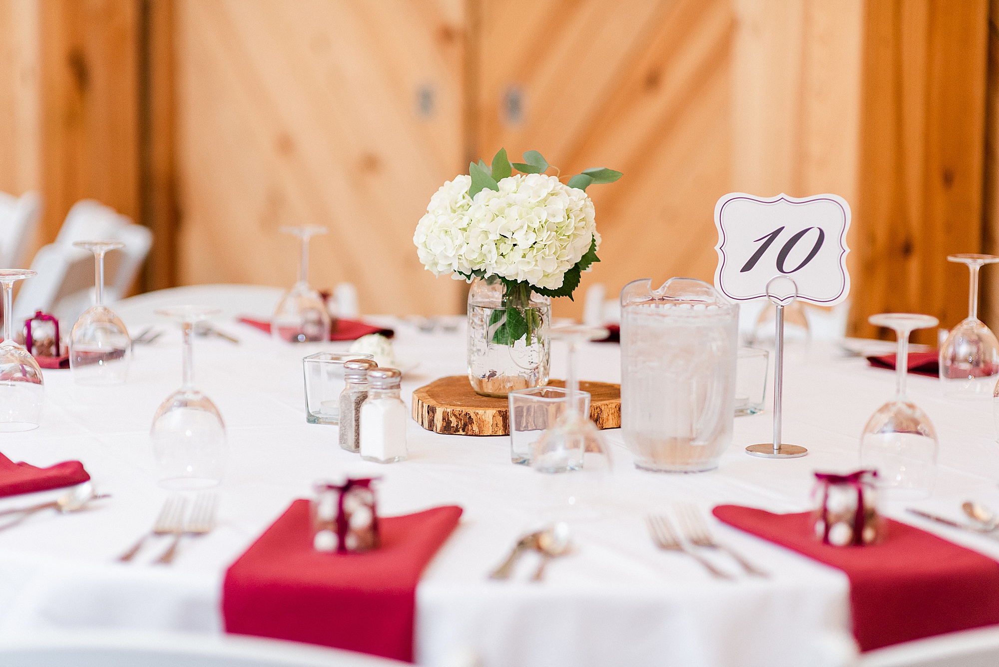reception details with red and gold place settings