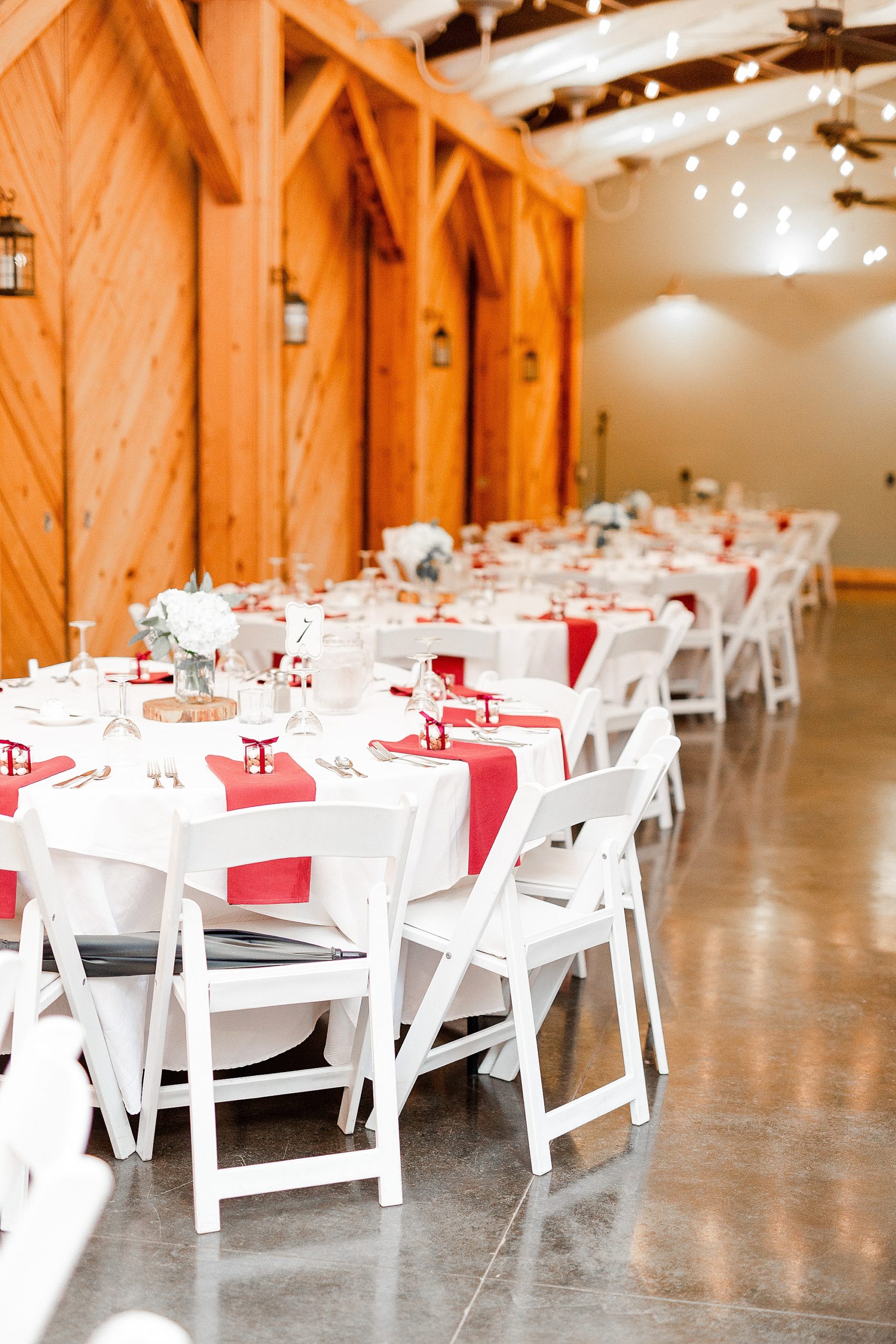 tables line walls at Alexander Homestead with red and gold details