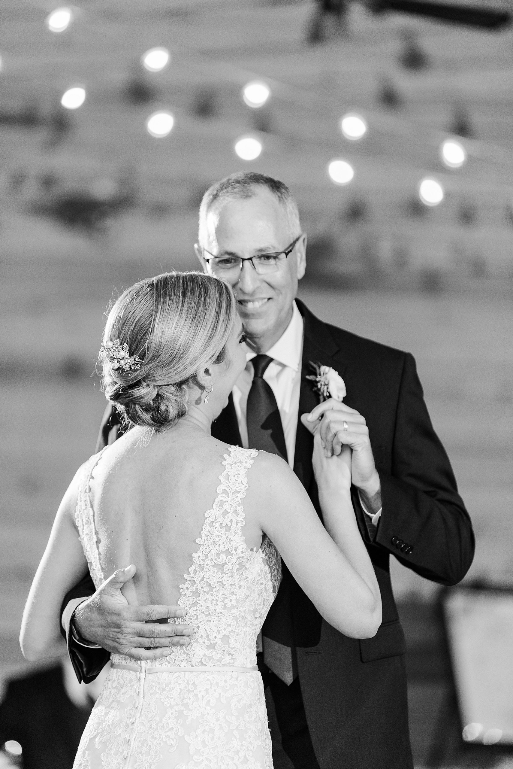 dad and bride dance together at wedding reception