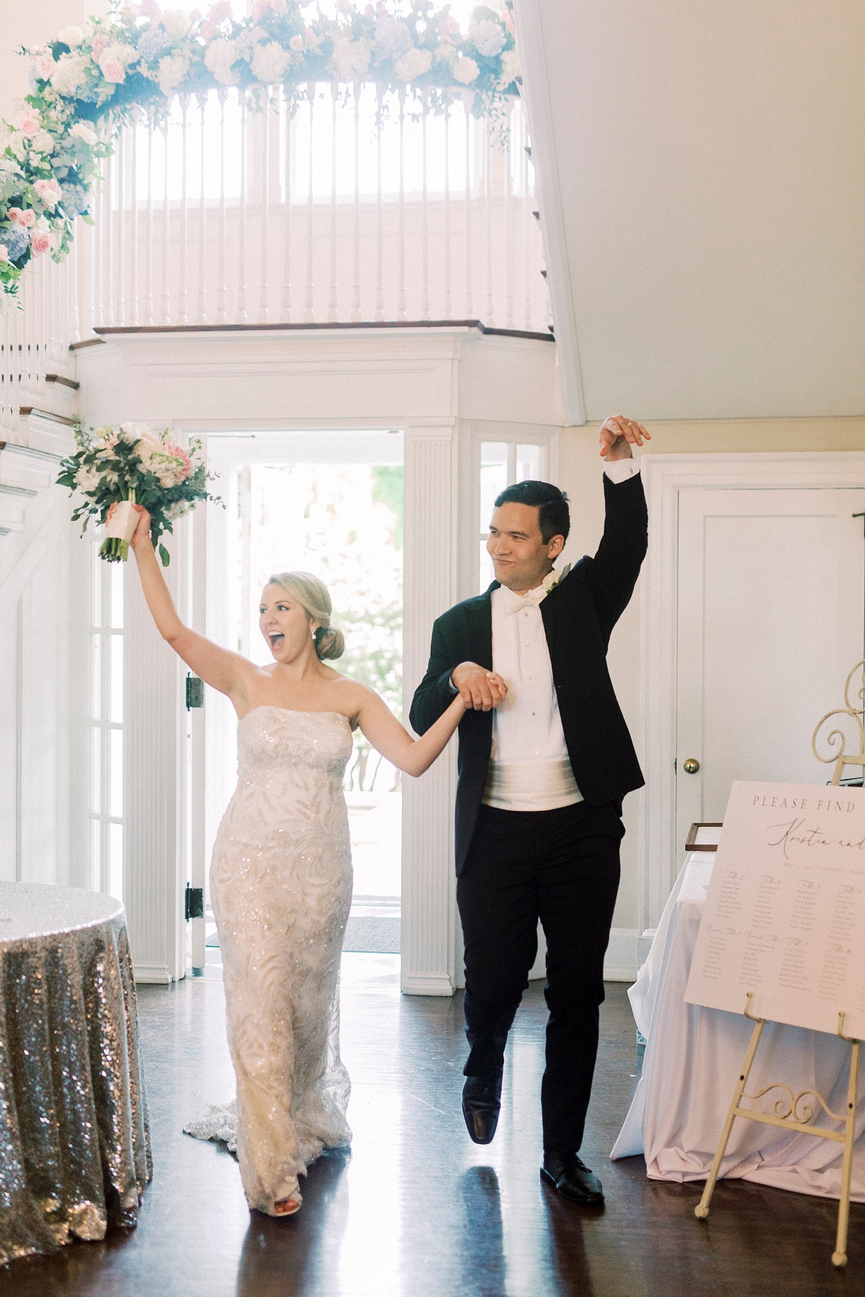 newlyweds cheer entering wedding reception at Separk Mansion