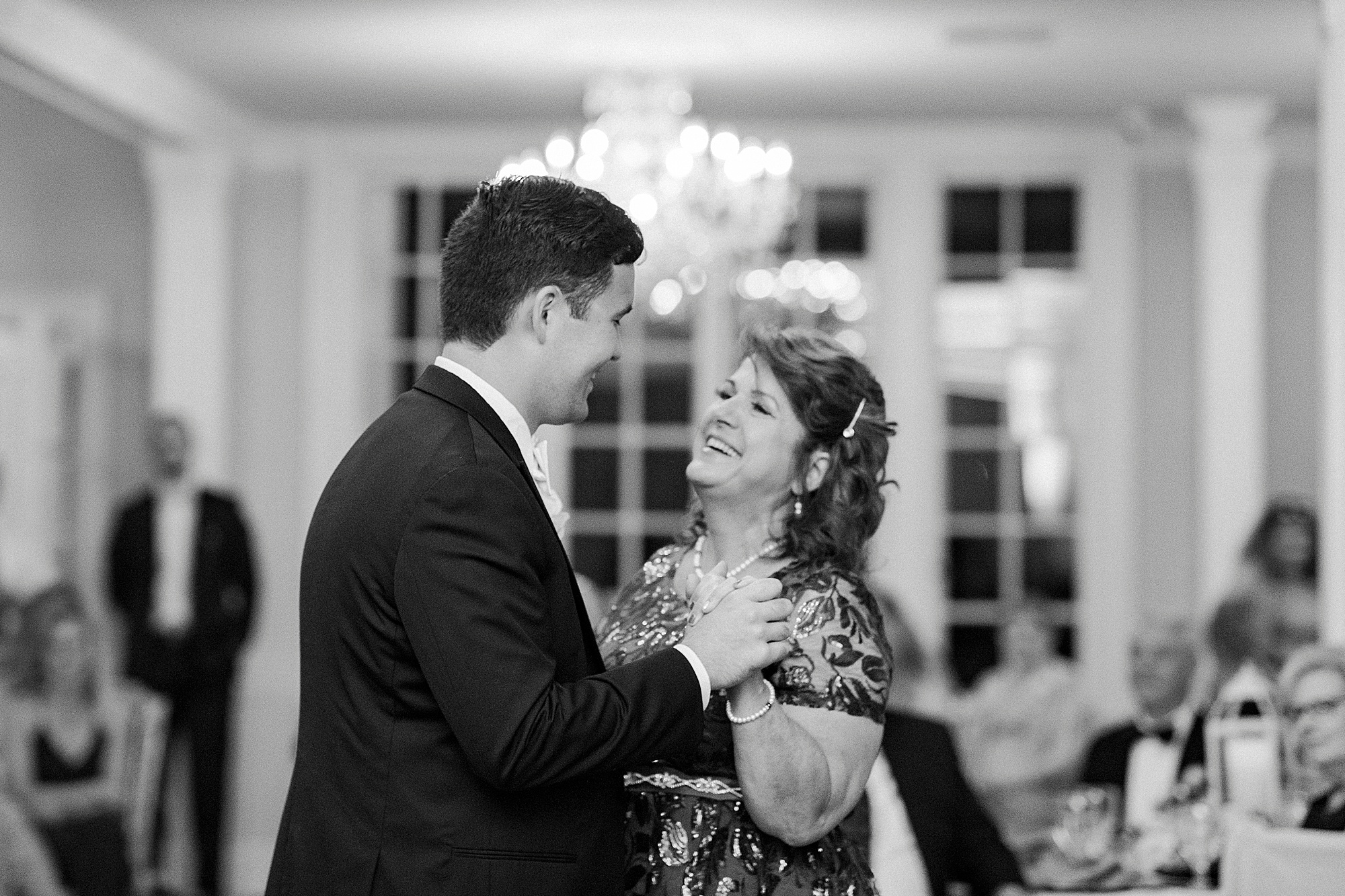 groom and mom dance during NC wedding reception
