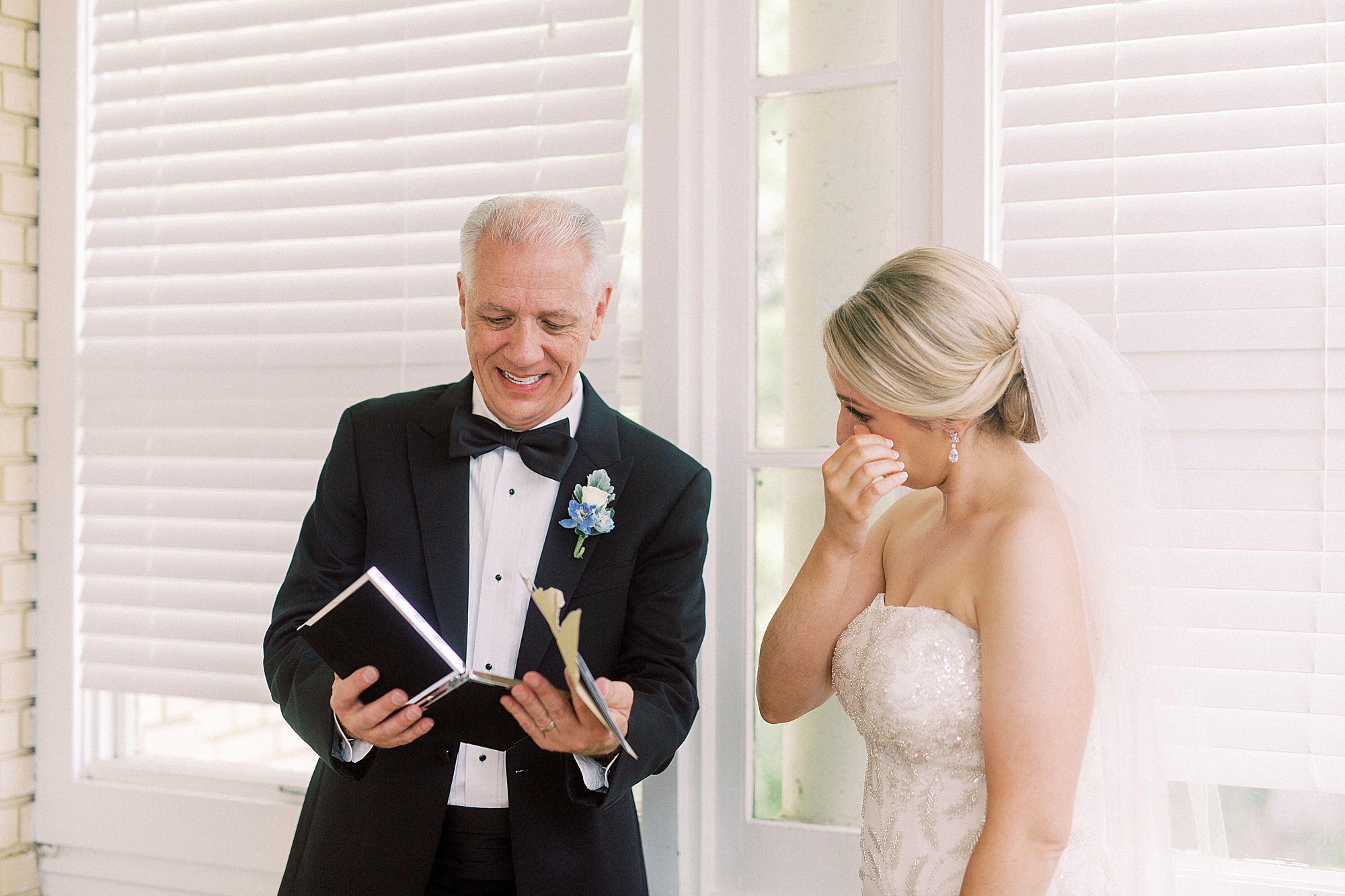 bride cries during first look with dad before elegant Charlotte wedding