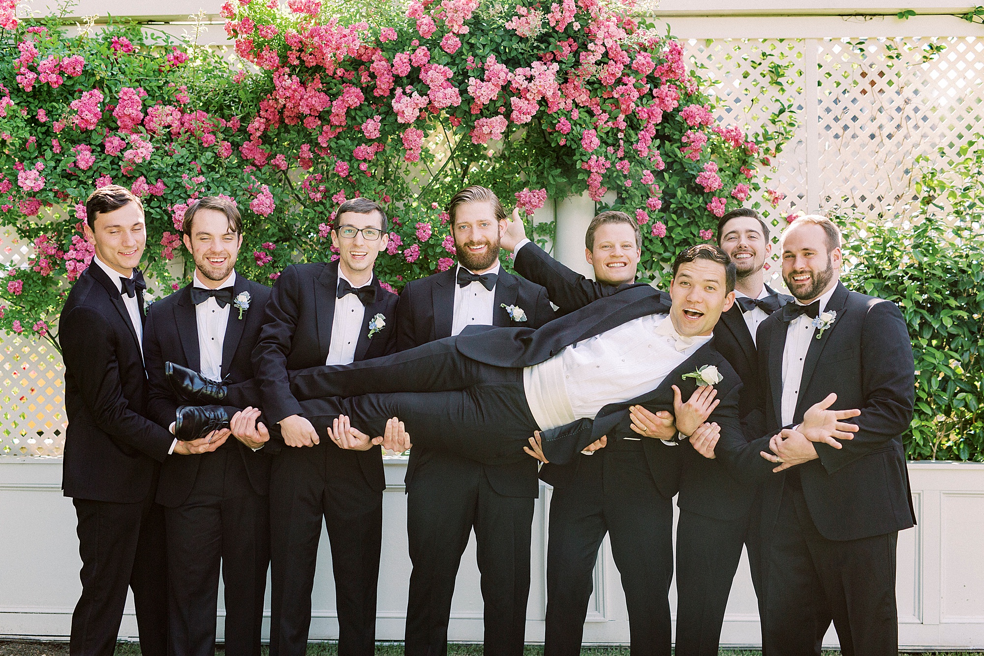 groomsmen lift up groom during Separk Mansion wedding day