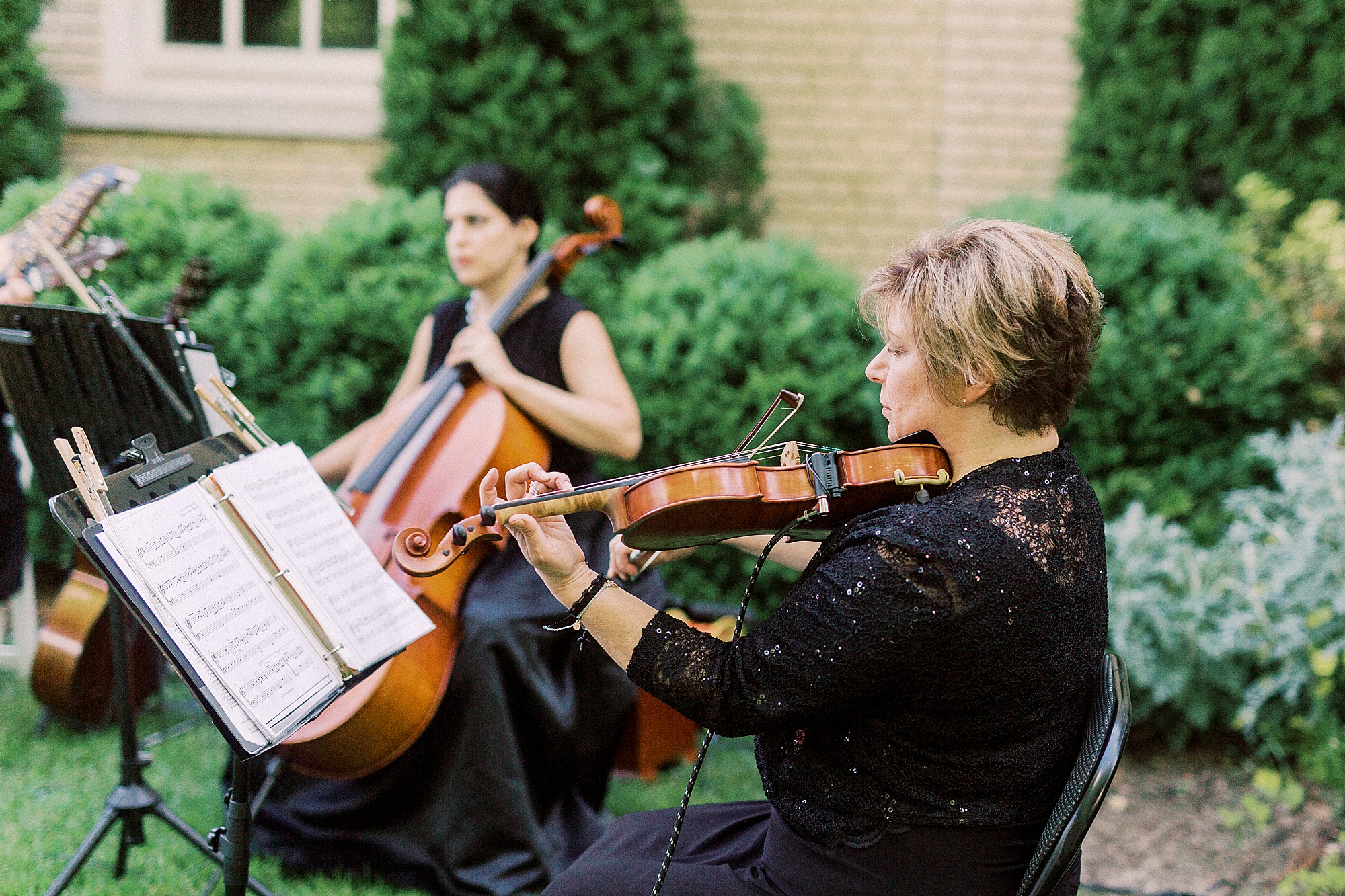 string musicians play during outdoor wedding ceremony at Separk Mansion